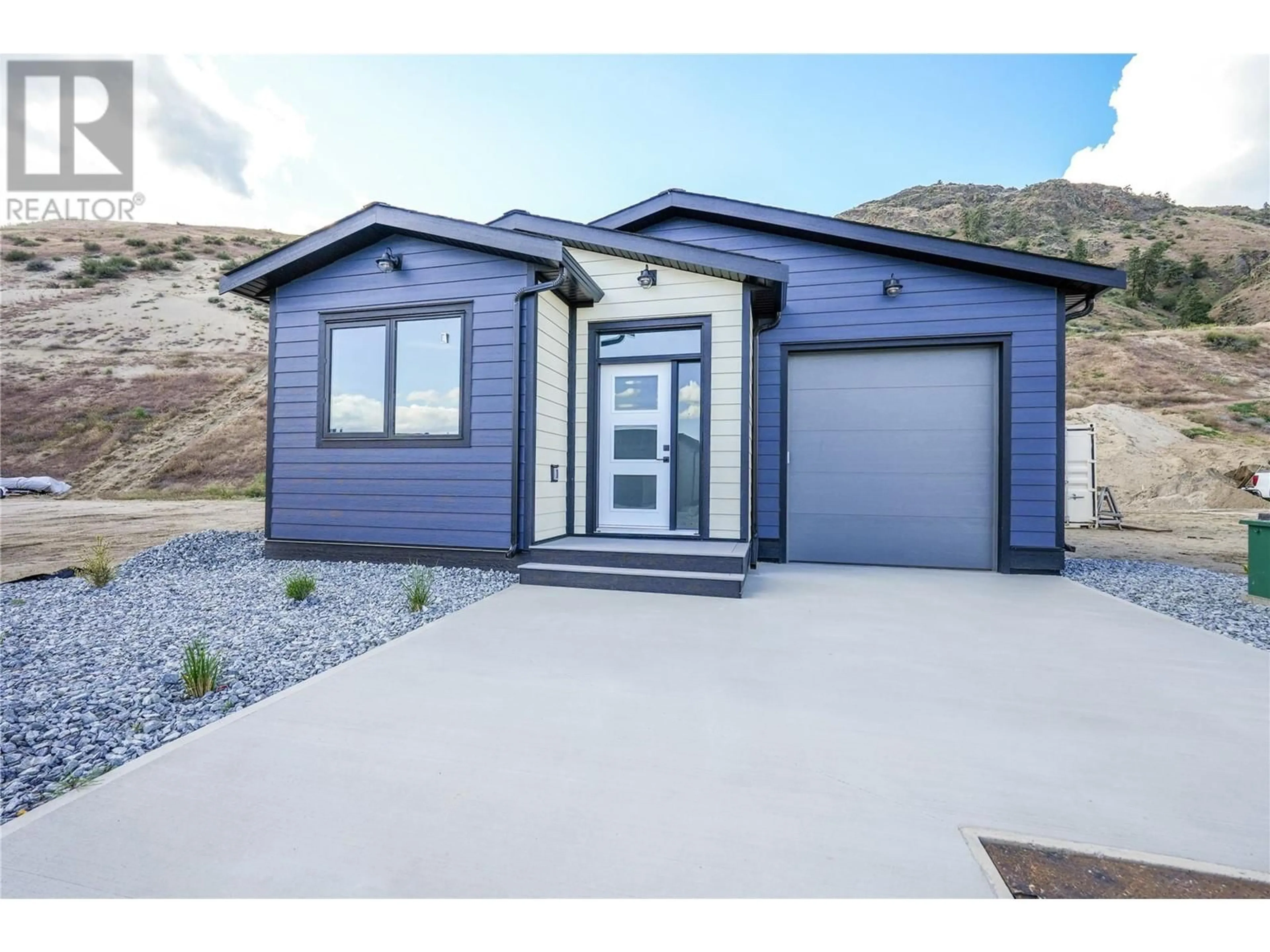 Home with vinyl exterior material, street for 1250 COPPER ROAD, Oliver British Columbia V0H1T5
