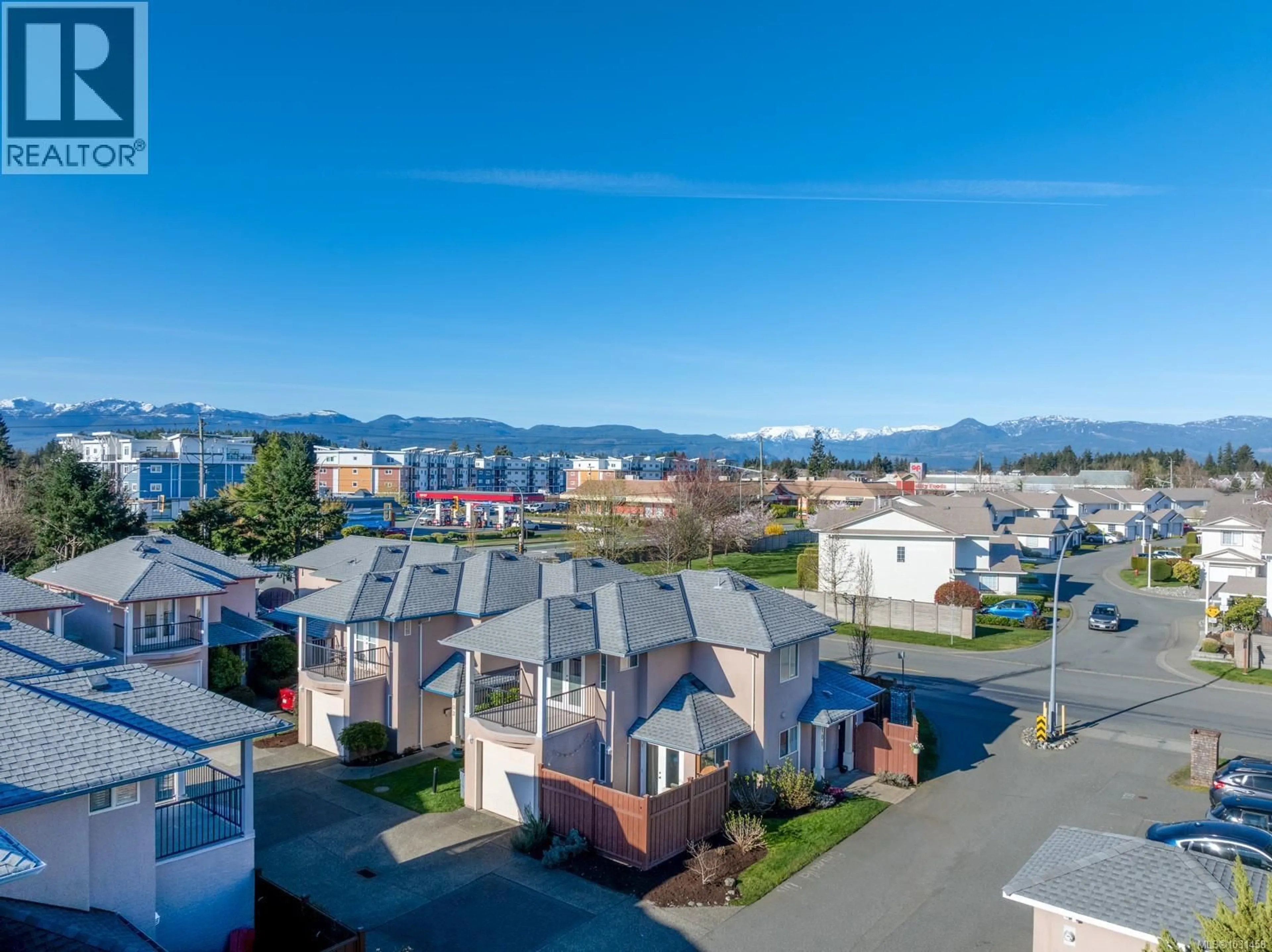 A pic from outside/outdoor area/front of a property/back of a property/a pic from drone, unknown for 101 - 720 ASPEN ROAD, Comox British Columbia V9M3Y4