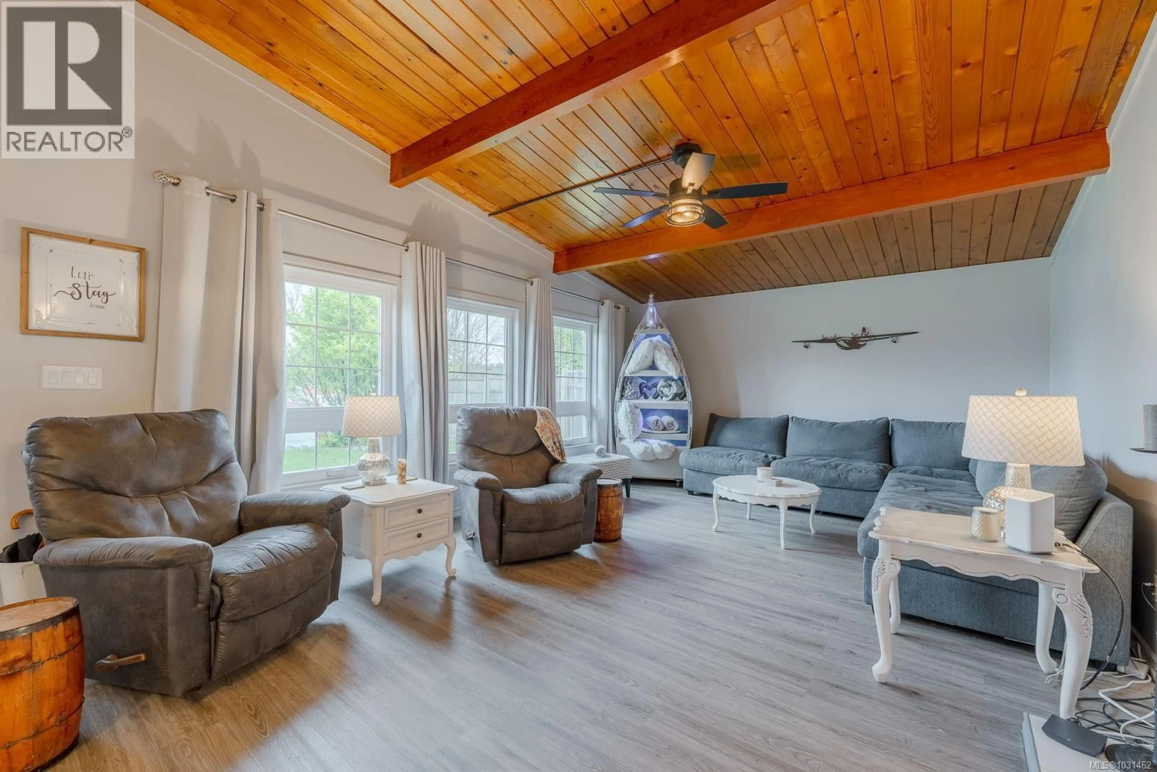 Living room with furniture, wood/laminate floor for 5032 CHERRY CREEK ROAD, Port Alberni British Columbia V9Y6Y7