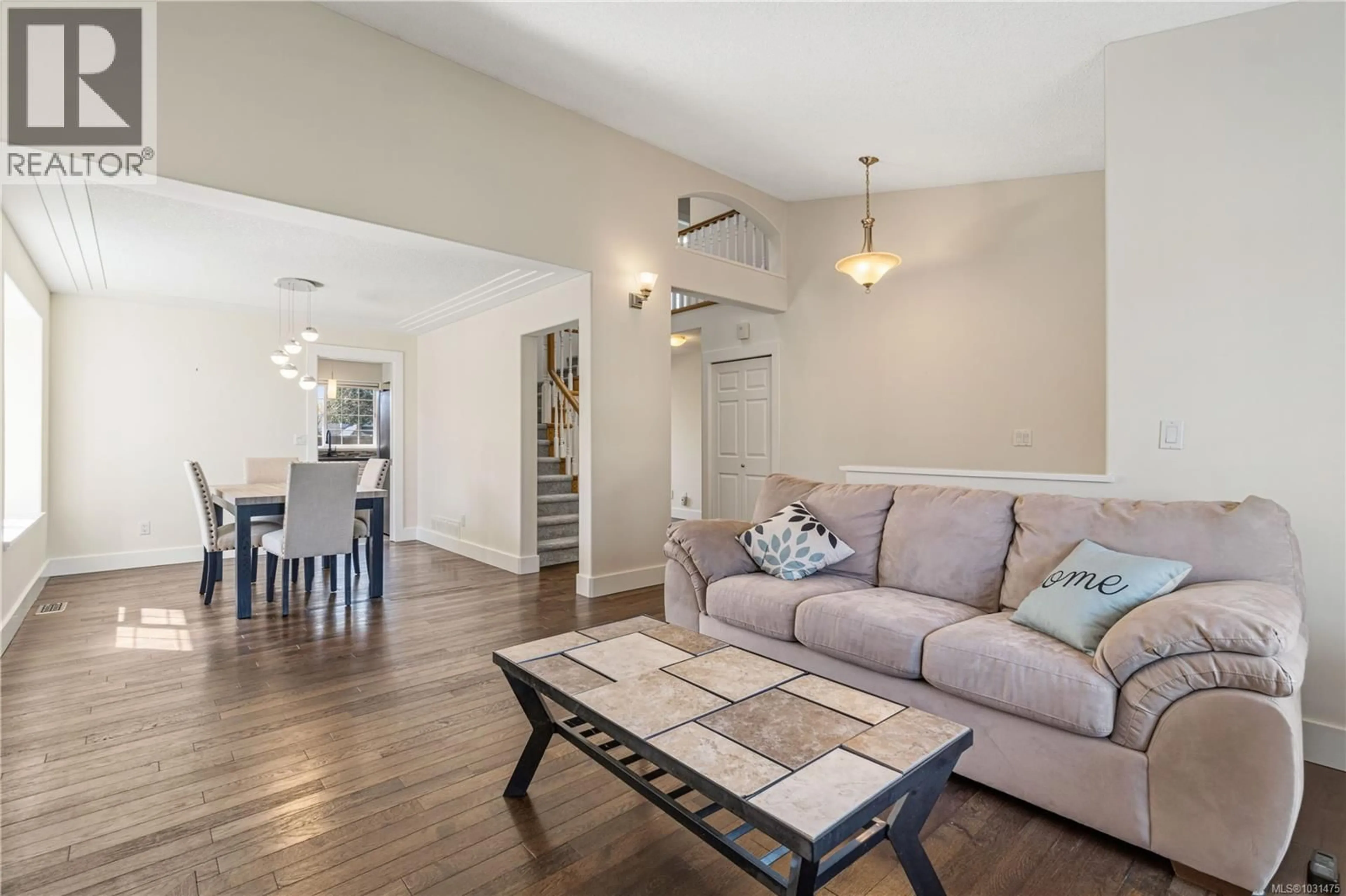 Living room with furniture, wood/laminate floor for 716 ERMINESKIN AVENUE, Parksville British Columbia V9P2L4