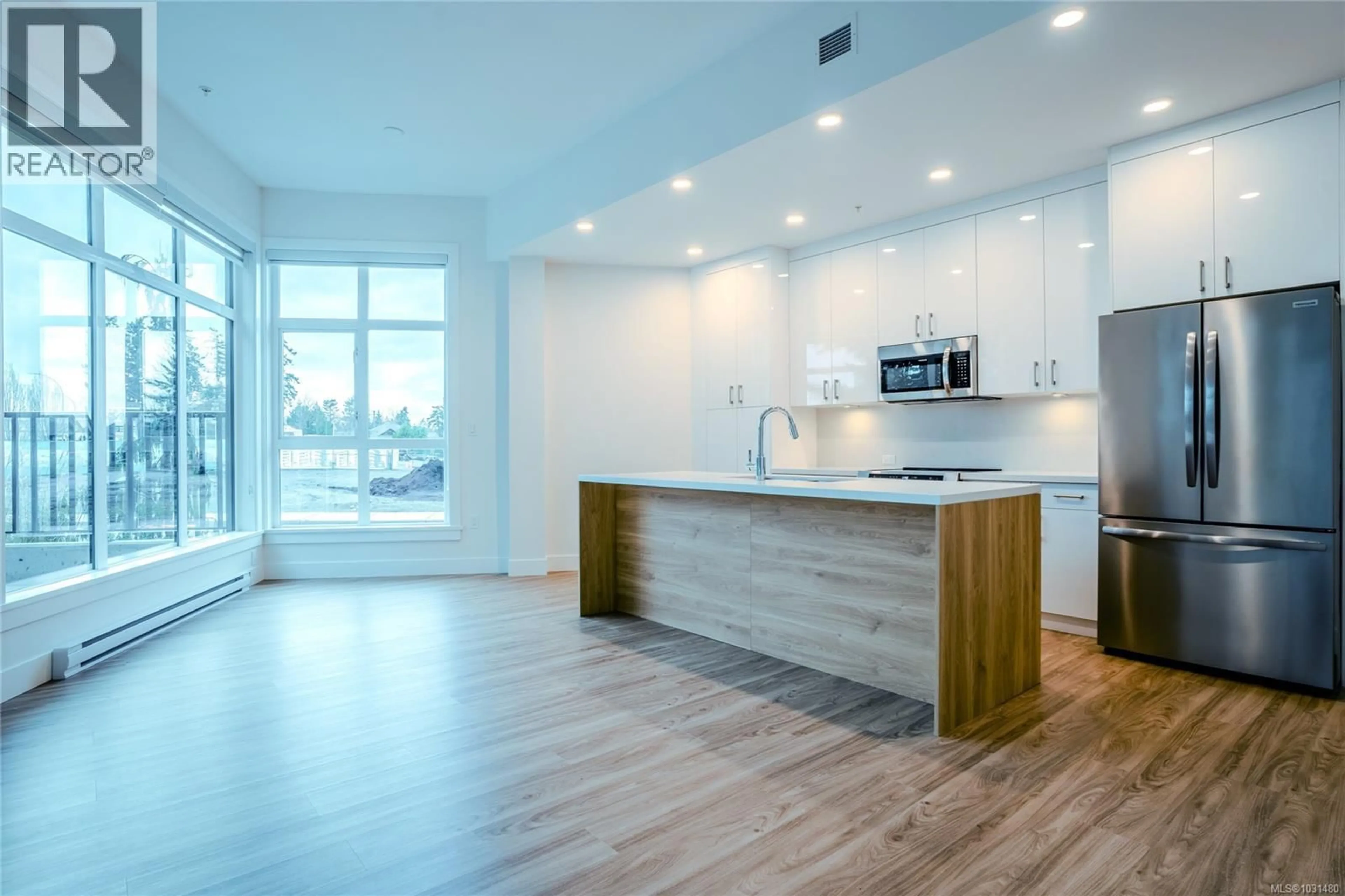 Open concept kitchen, wood/laminate floor for 104 - 6320 SENTINAL DRIVE, Nanaimo British Columbia V9V1W4