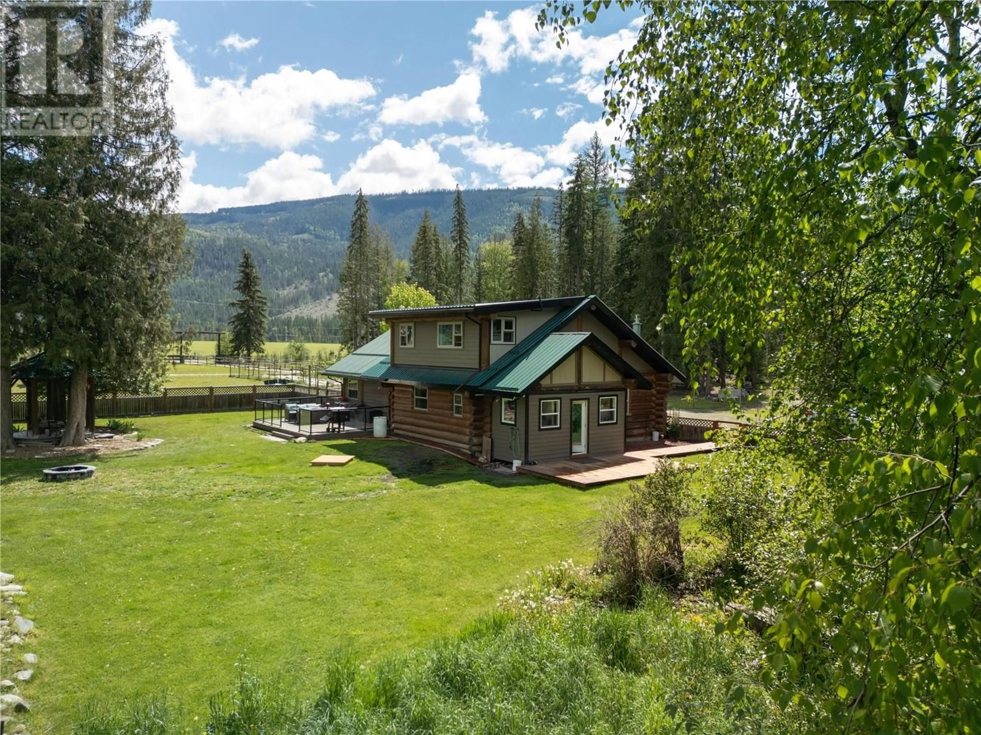 A pic from outside/outdoor area/front of a property/back of a property/a pic from drone, mountain view for 28 BEGBIE ROAD, Cherryville British Columbia V0E2G3