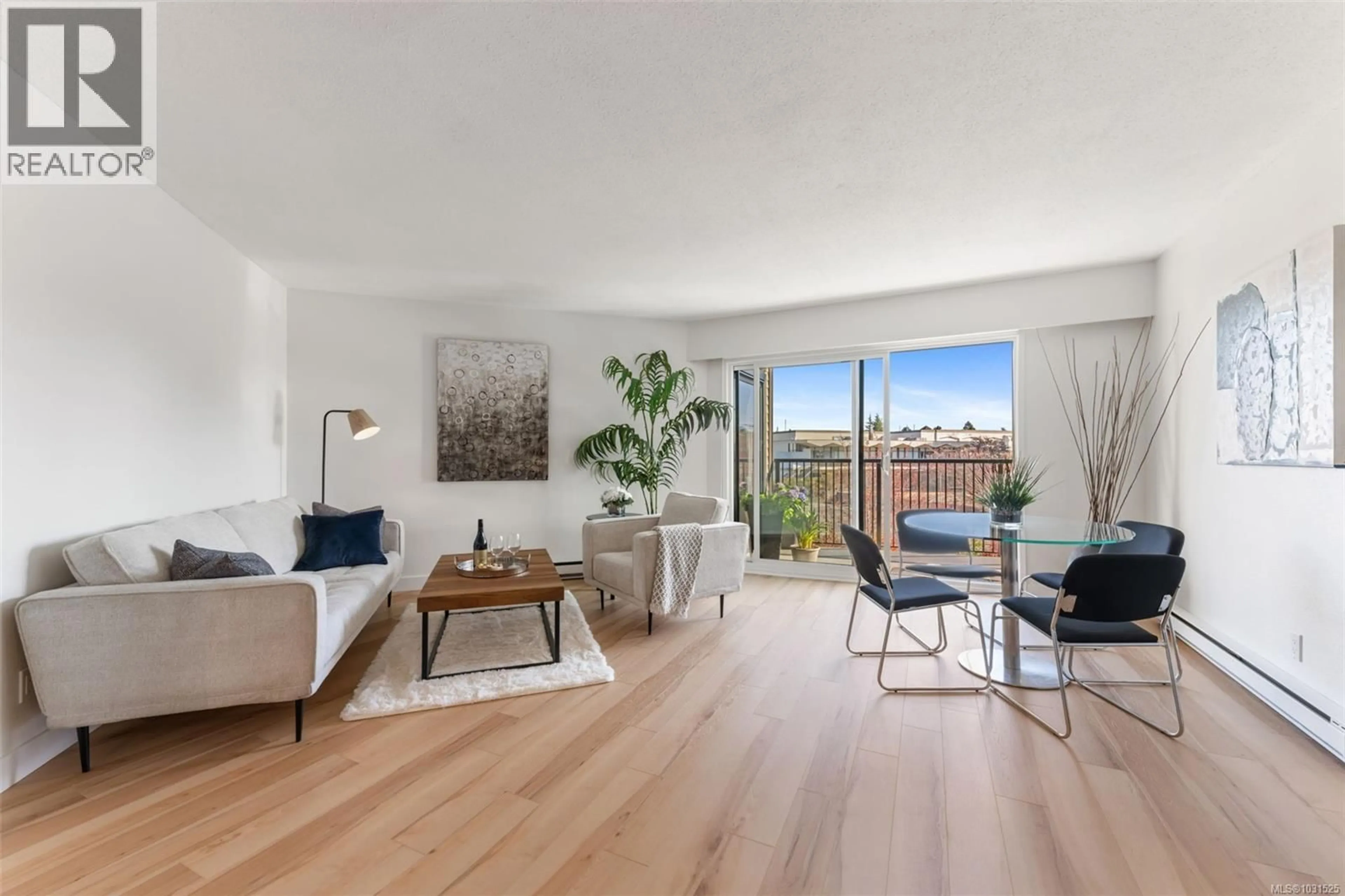 Living room with furniture, wood/laminate floor for 319 - 1870 MCKENZIE AVENUE, Saanich British Columbia V8N4X3