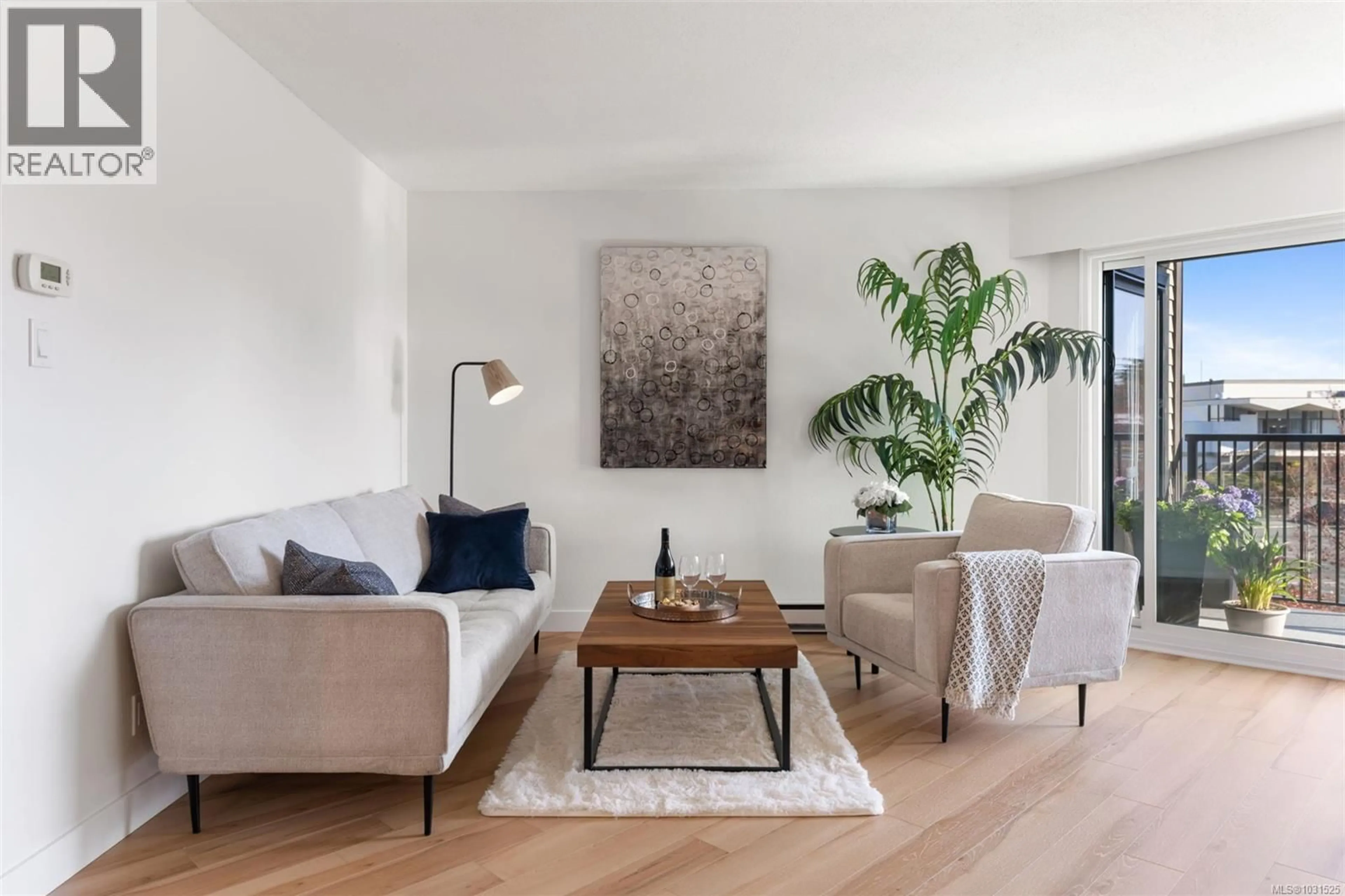 Living room with furniture, wood/laminate floor for 319 - 1870 MCKENZIE AVENUE, Saanich British Columbia V8N4X3