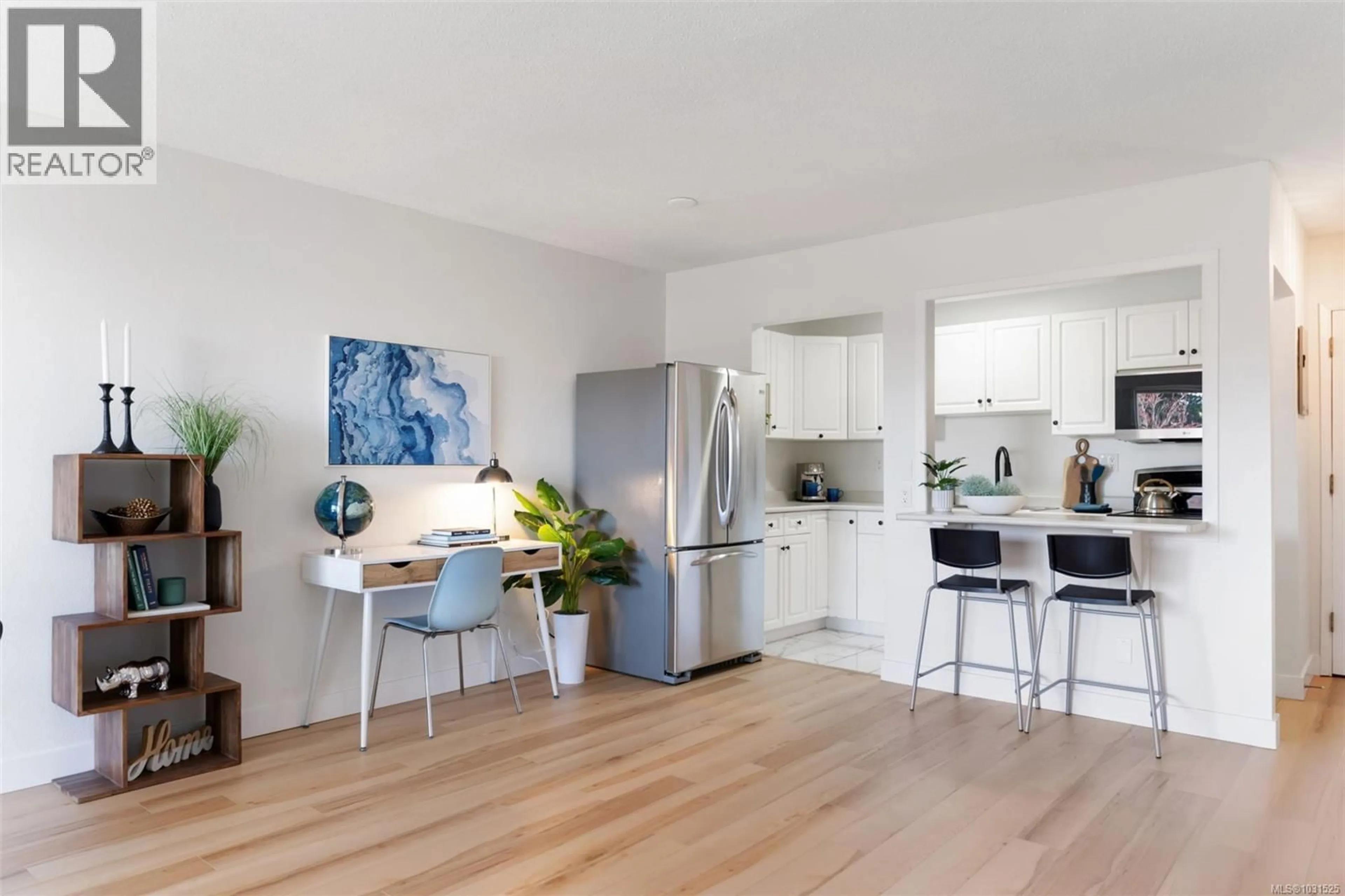 Open concept kitchen, wood/laminate floor for 319 - 1870 MCKENZIE AVENUE, Saanich British Columbia V8N4X3