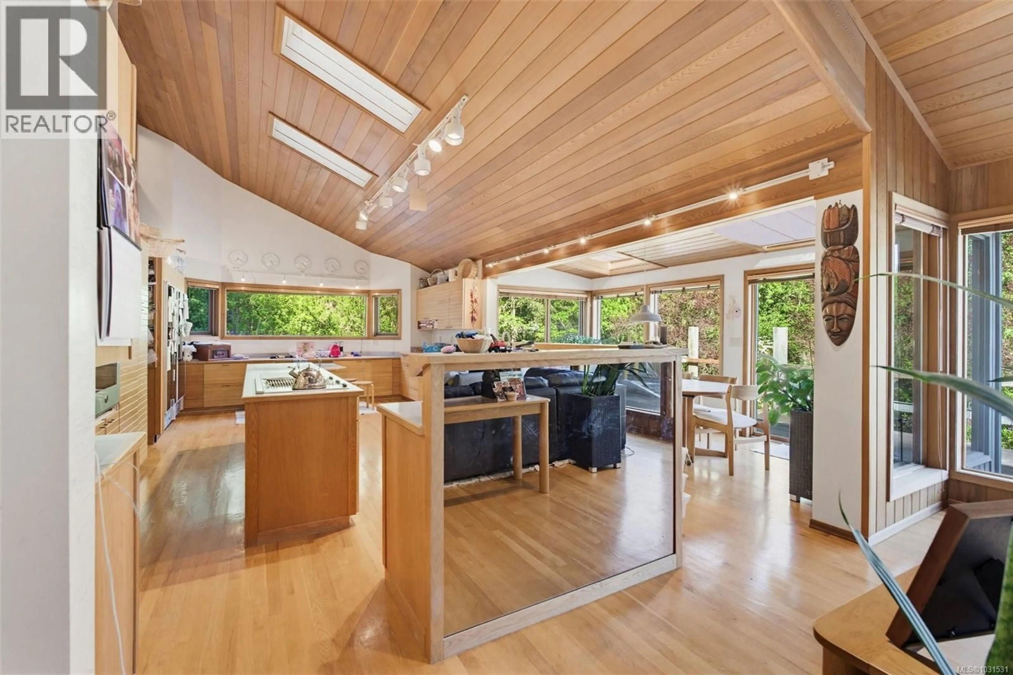Open concept kitchen, wood/laminate floor for 5630 BATU ROAD, Saanich British Columbia V8Z6K5