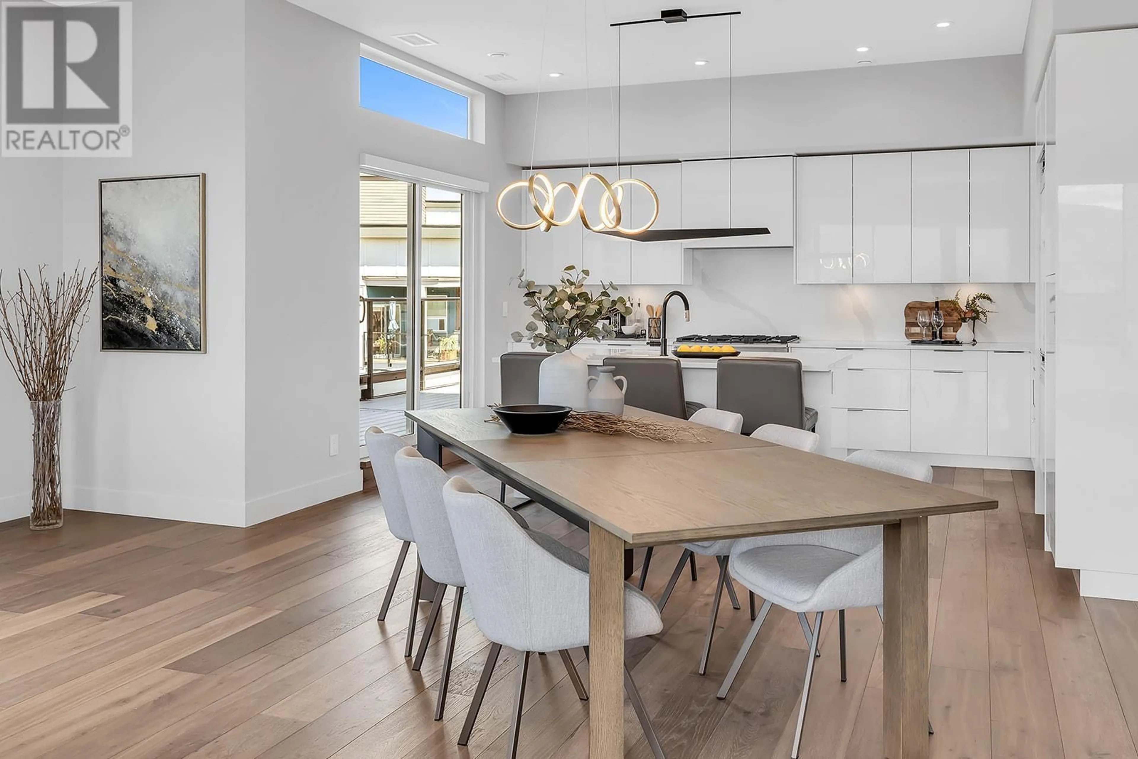 Open concept kitchen, wood/laminate floor for 601C - 3642 MISSION SPRINGS DRIVE, Kelowna British Columbia V1W0E1