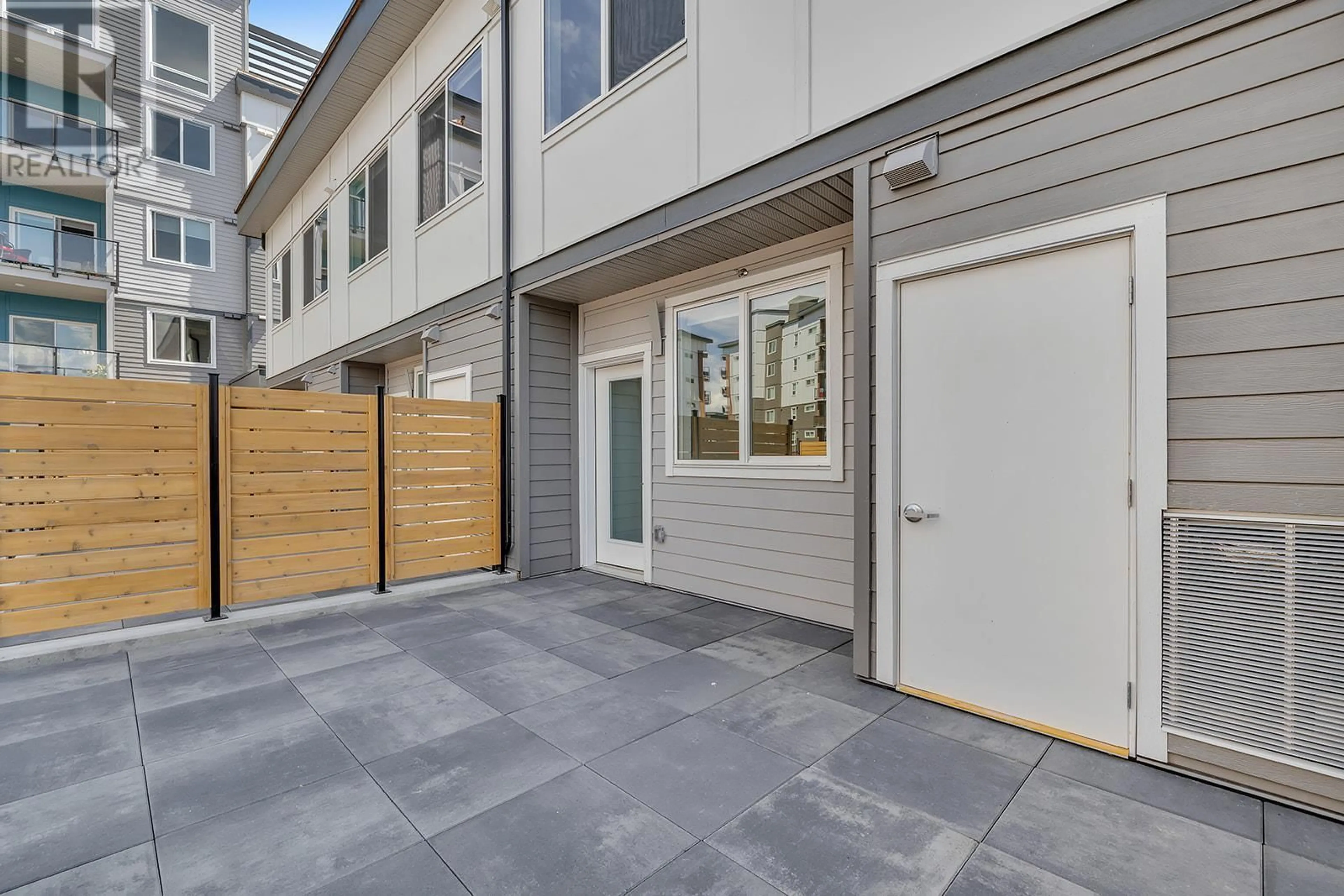 A pic from exterior of the house or condo, the fenced backyard for 3642 Mission Springs Drive Unit# 102C, Kelowna British Columbia V1W0E1