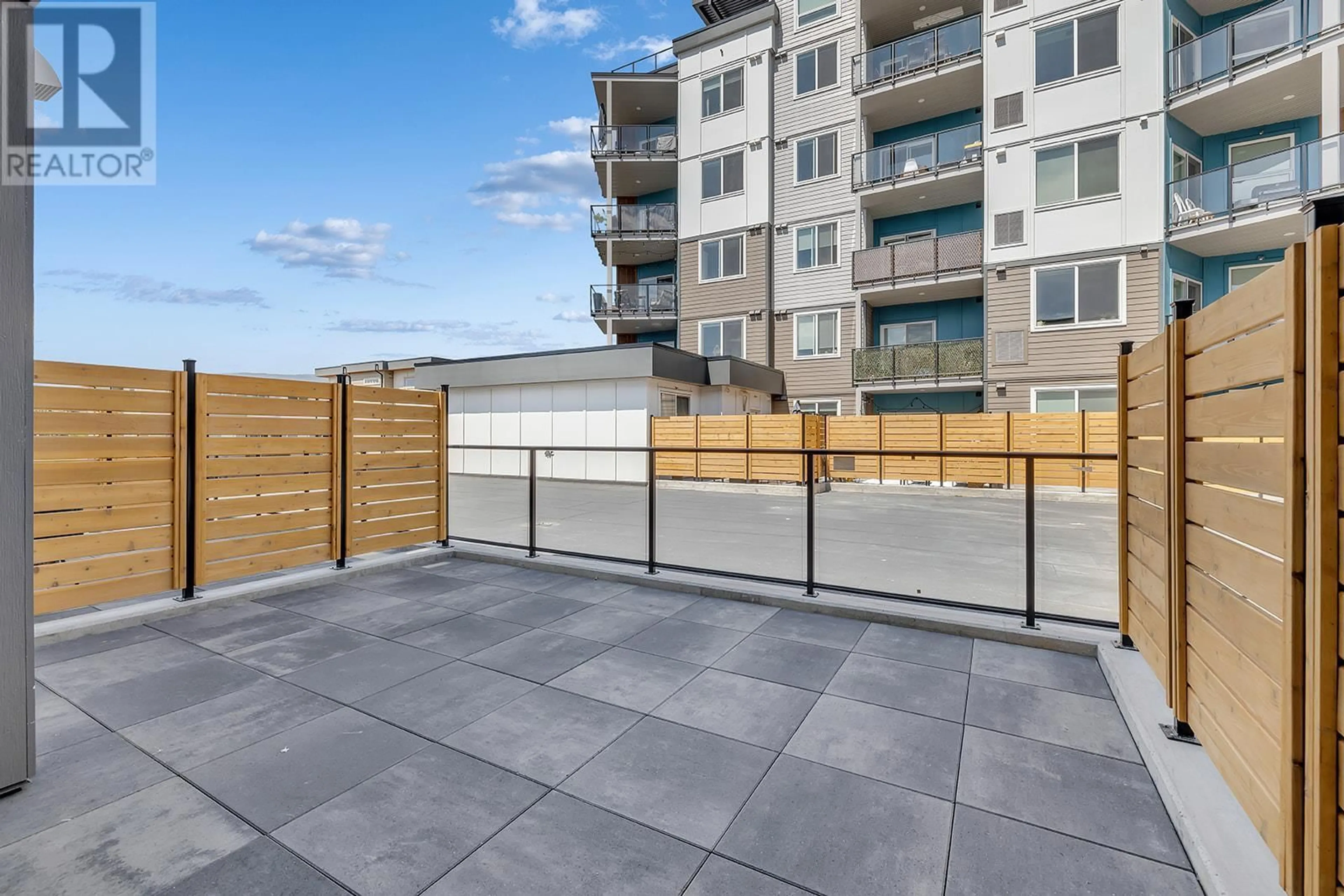 Patio, the fenced backyard for 3642 Mission Springs Drive Unit# 102C, Kelowna British Columbia V1W0E1