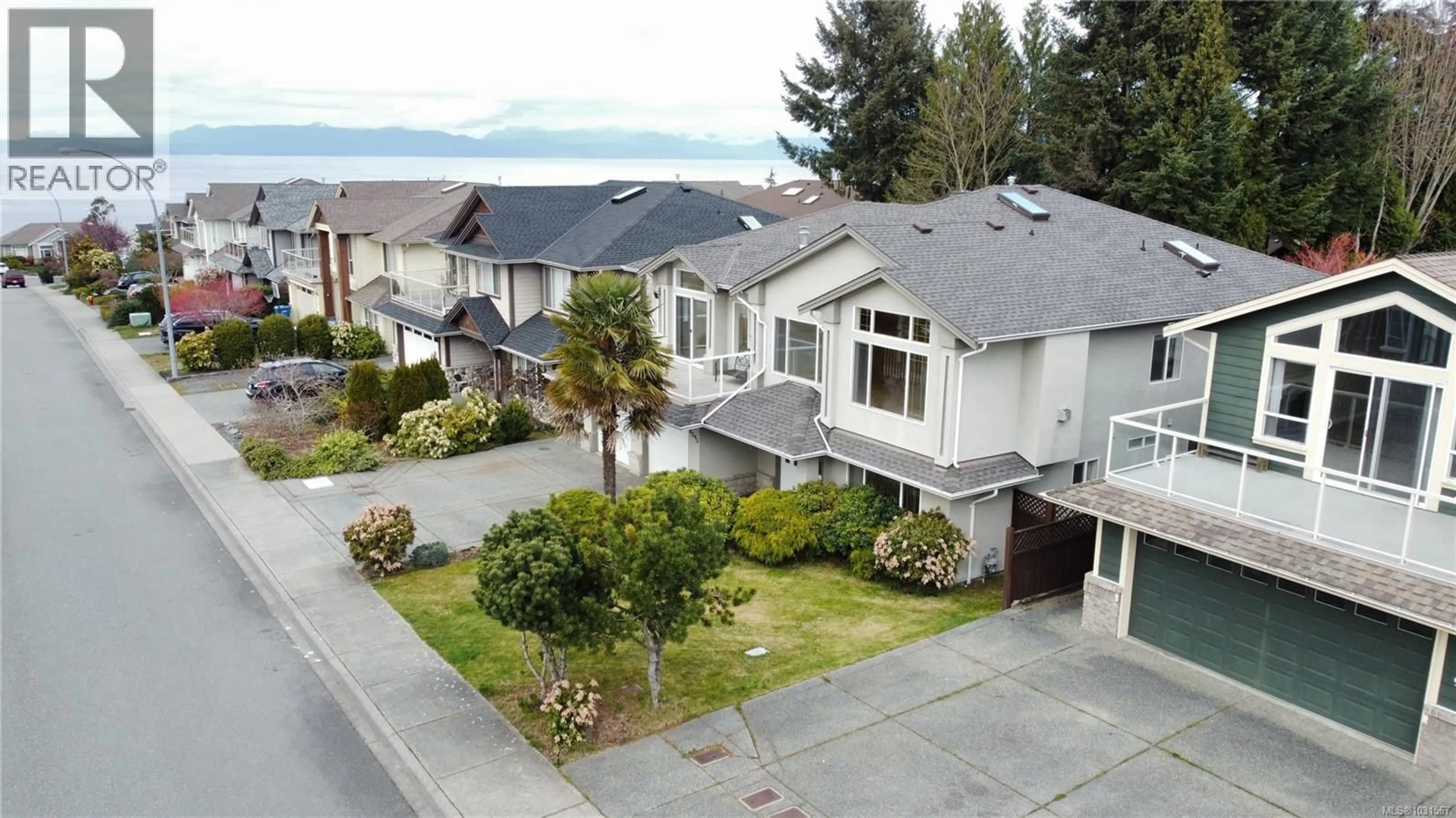 A pic from outside/outdoor area/front of a property/back of a property/a pic from drone, street for 6593 KESTREL CRESCENT, Nanaimo British Columbia V9V1V9