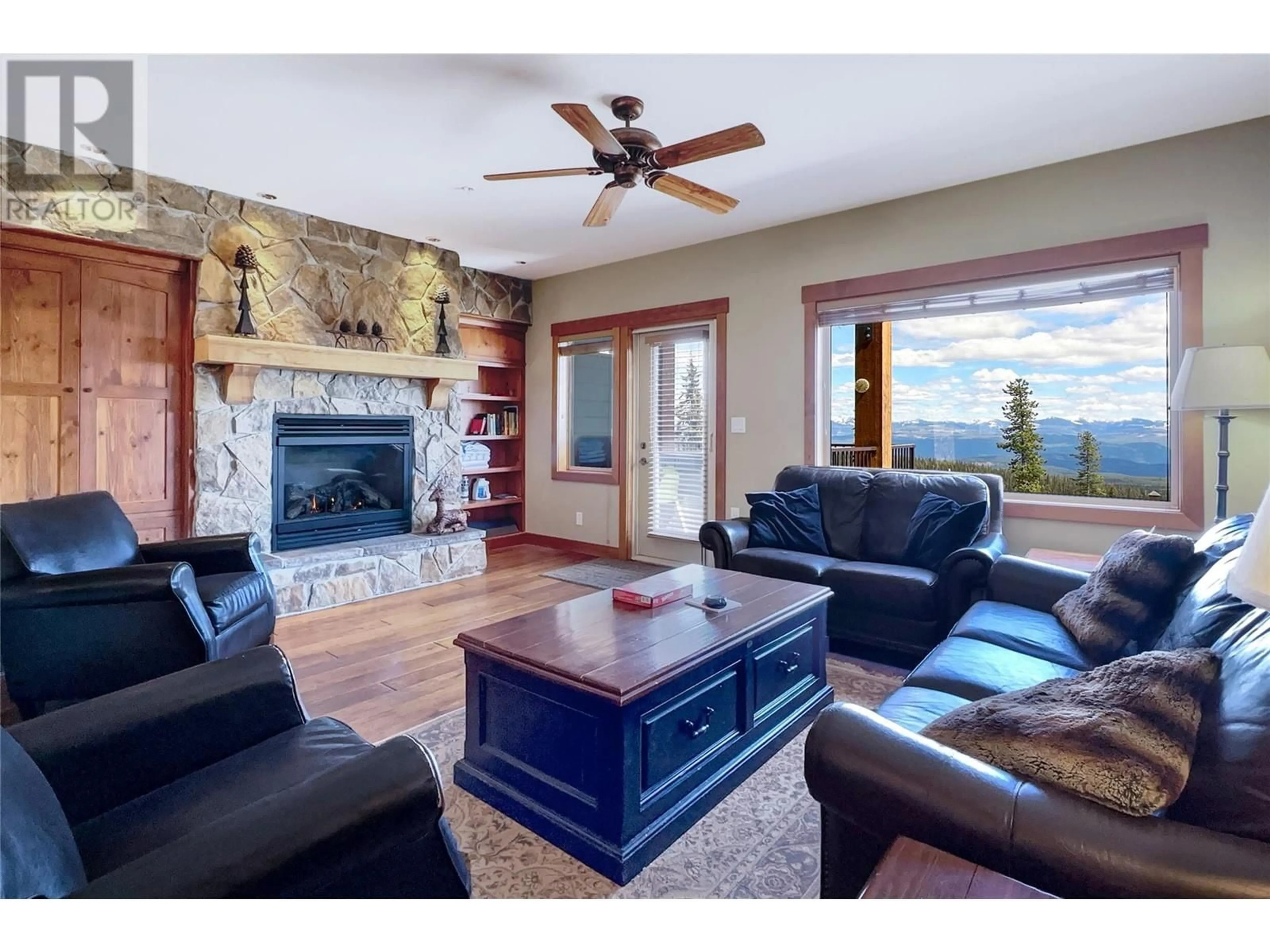 Living room with furniture, wood/laminate floor for 8 - 255 RAVEN RIDGE ROAD, Big White British Columbia V1P1P3