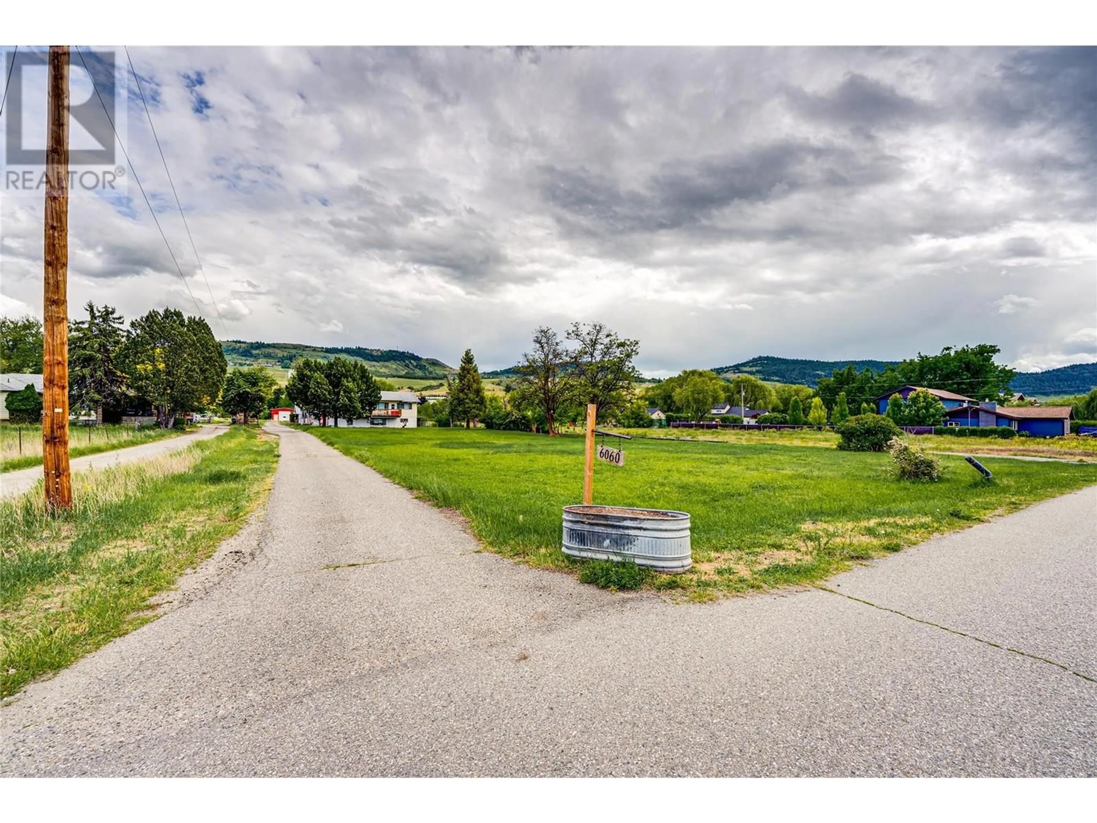 A pic from outside/outdoor area/front of a property/back of a property/a pic from drone, mountain view for 6060 OKANAGAN LANDING ROAD, Vernon British Columbia V1H1M3