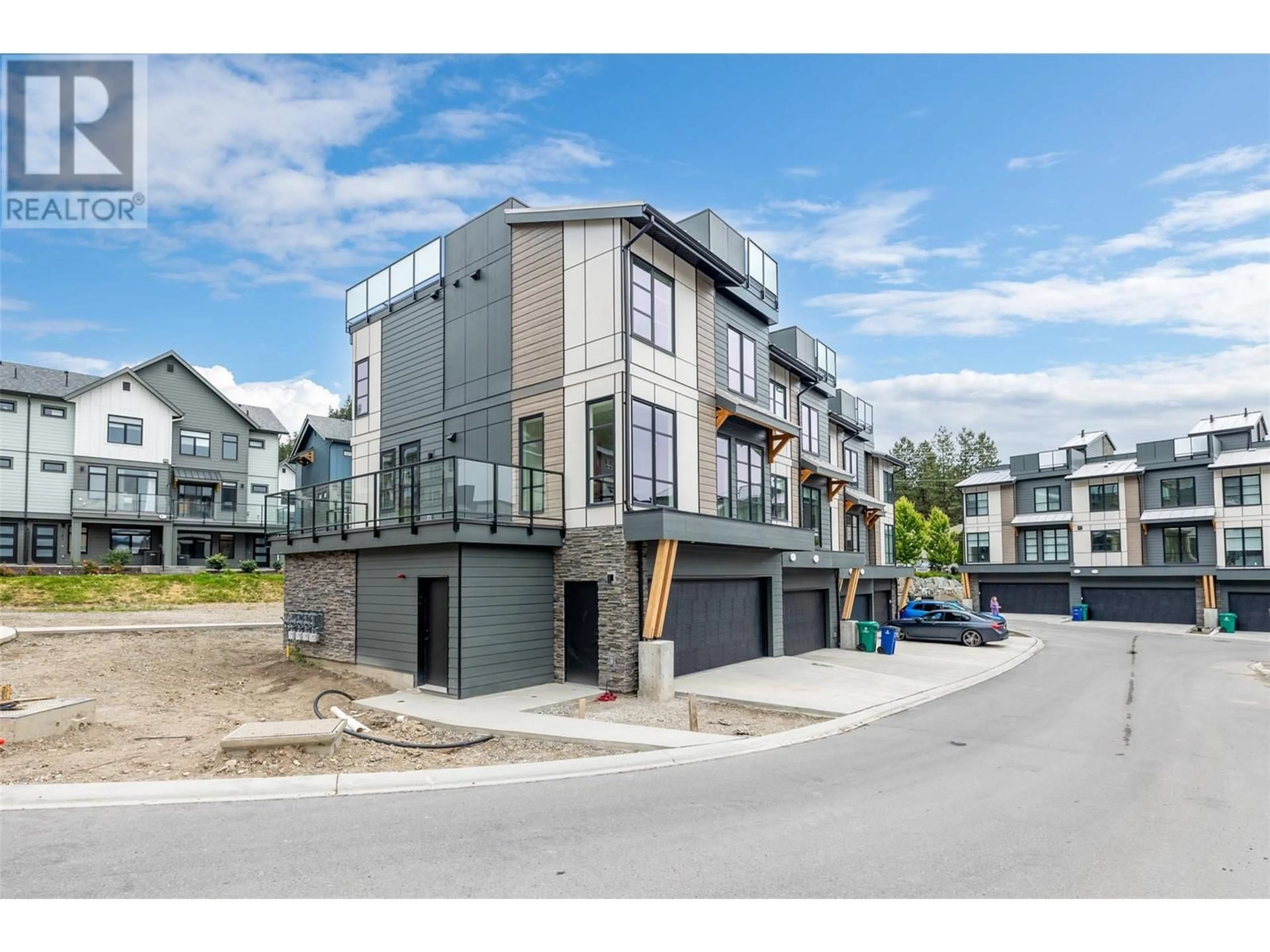 A pic from outside/outdoor area/front of a property/back of a property/a pic from drone, street for 101 - 1455 CARA GLEN COURT, Kelowna British Columbia V1V2J1