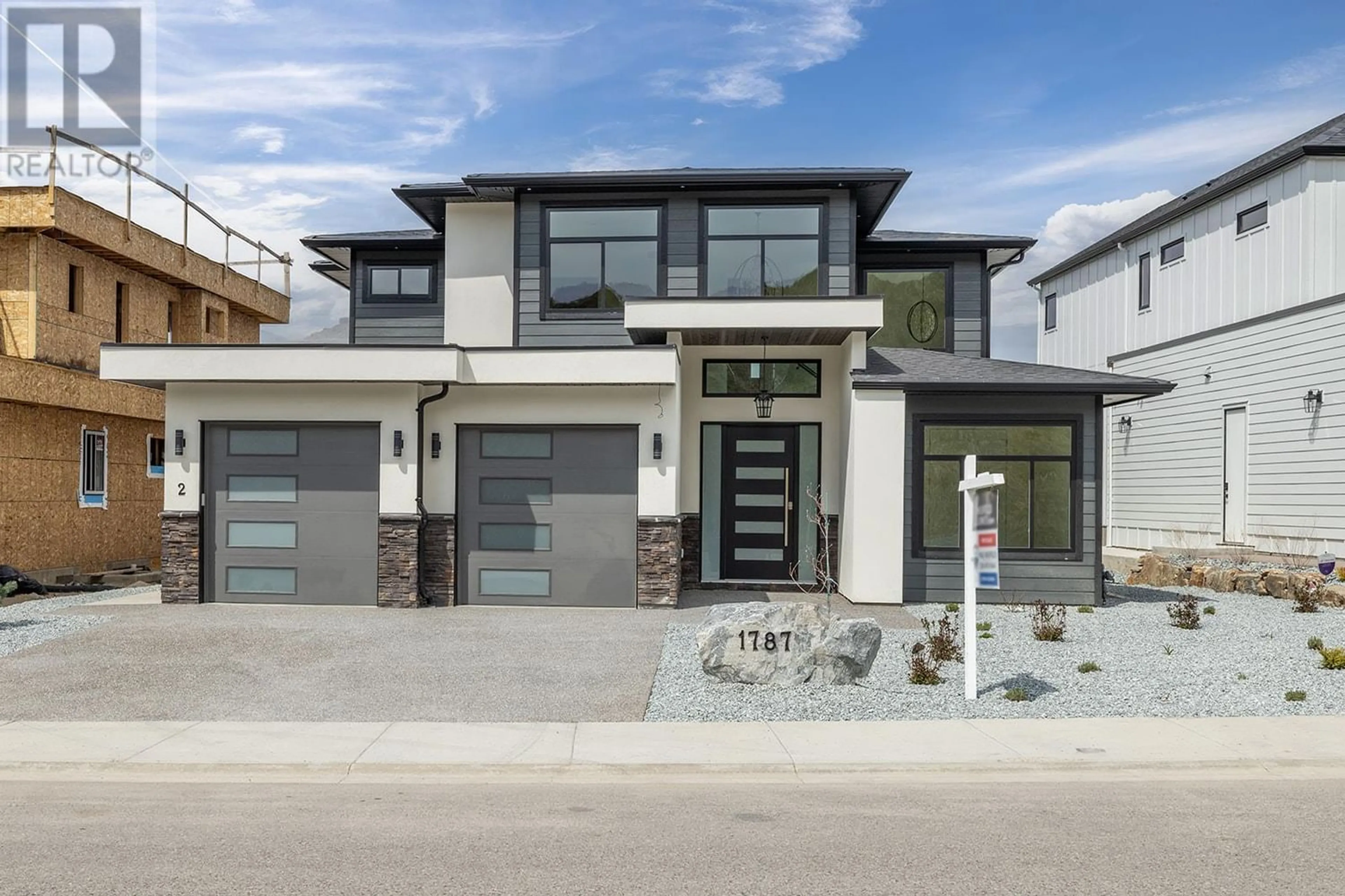 Frontside or backside of a home, the street view for 1787 Fawn Run Drive, Kelowna British Columbia V1W5N9