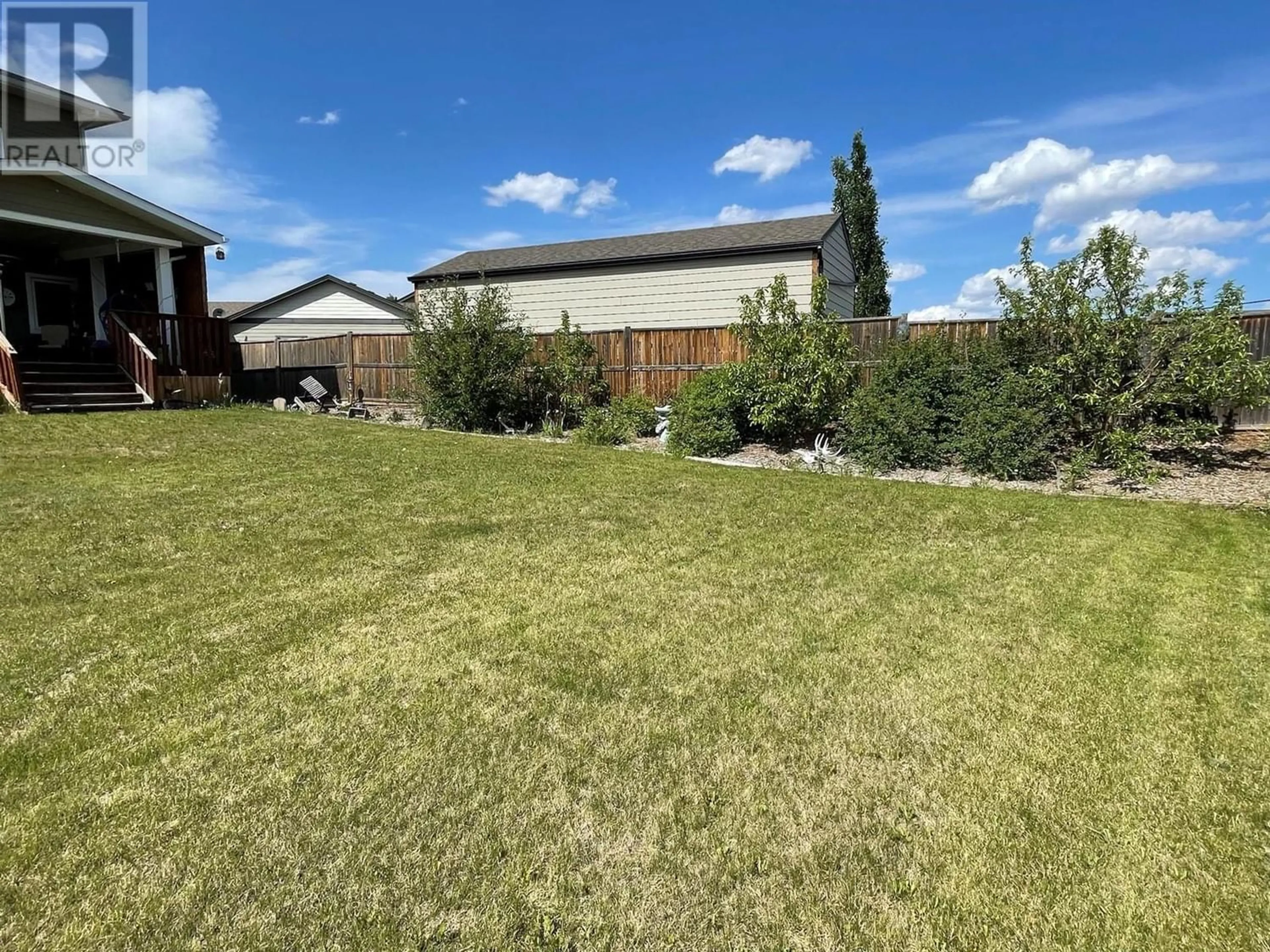 A pic from outside/outdoor area/front of a property/back of a property/a pic from drone, mountain view for 805 89 Avenue, Dawson Creek British Columbia V1G0A8