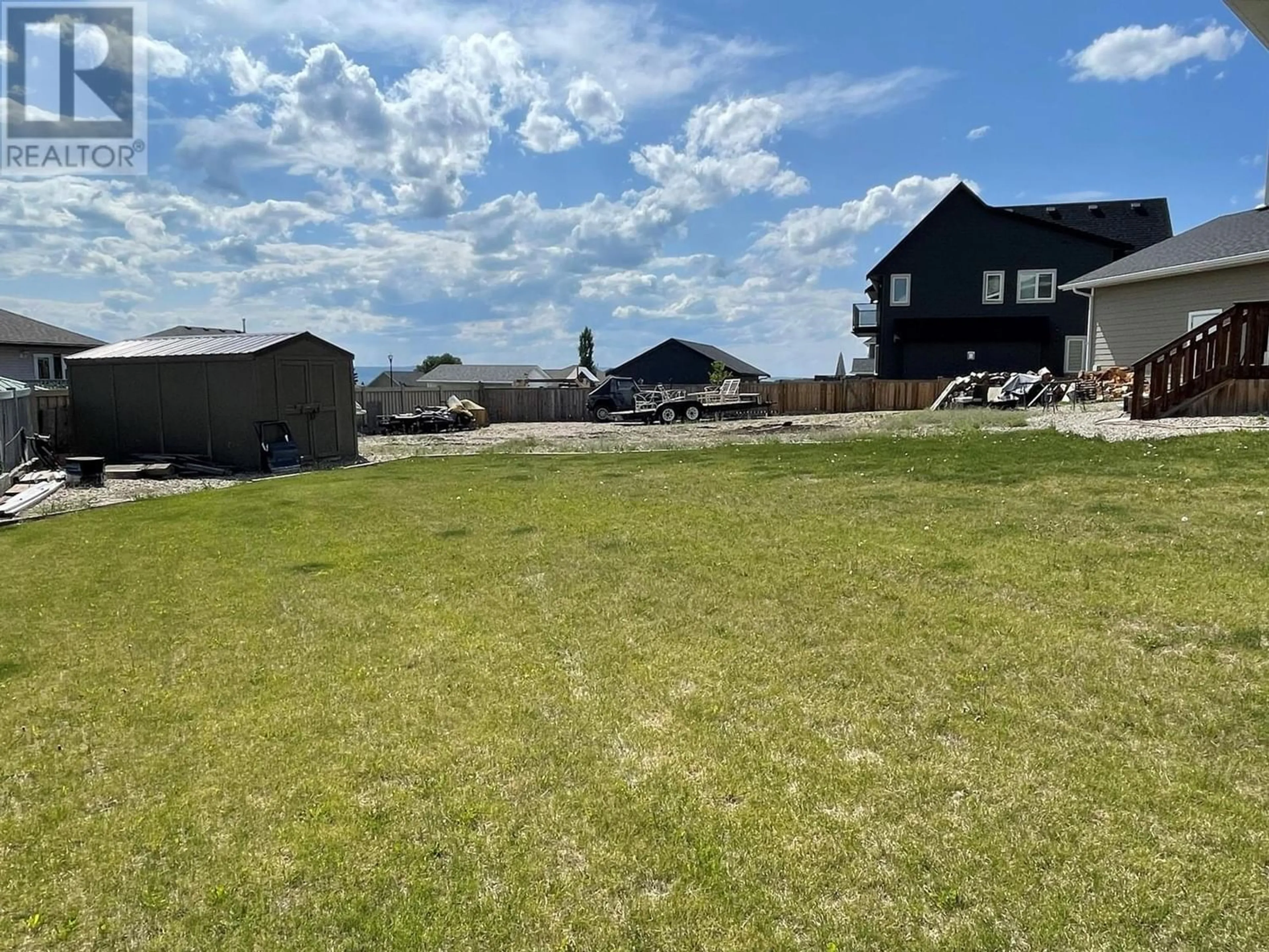 A pic from outside/outdoor area/front of a property/back of a property/a pic from drone, unknown for 805 89 Avenue, Dawson Creek British Columbia V1G0A8