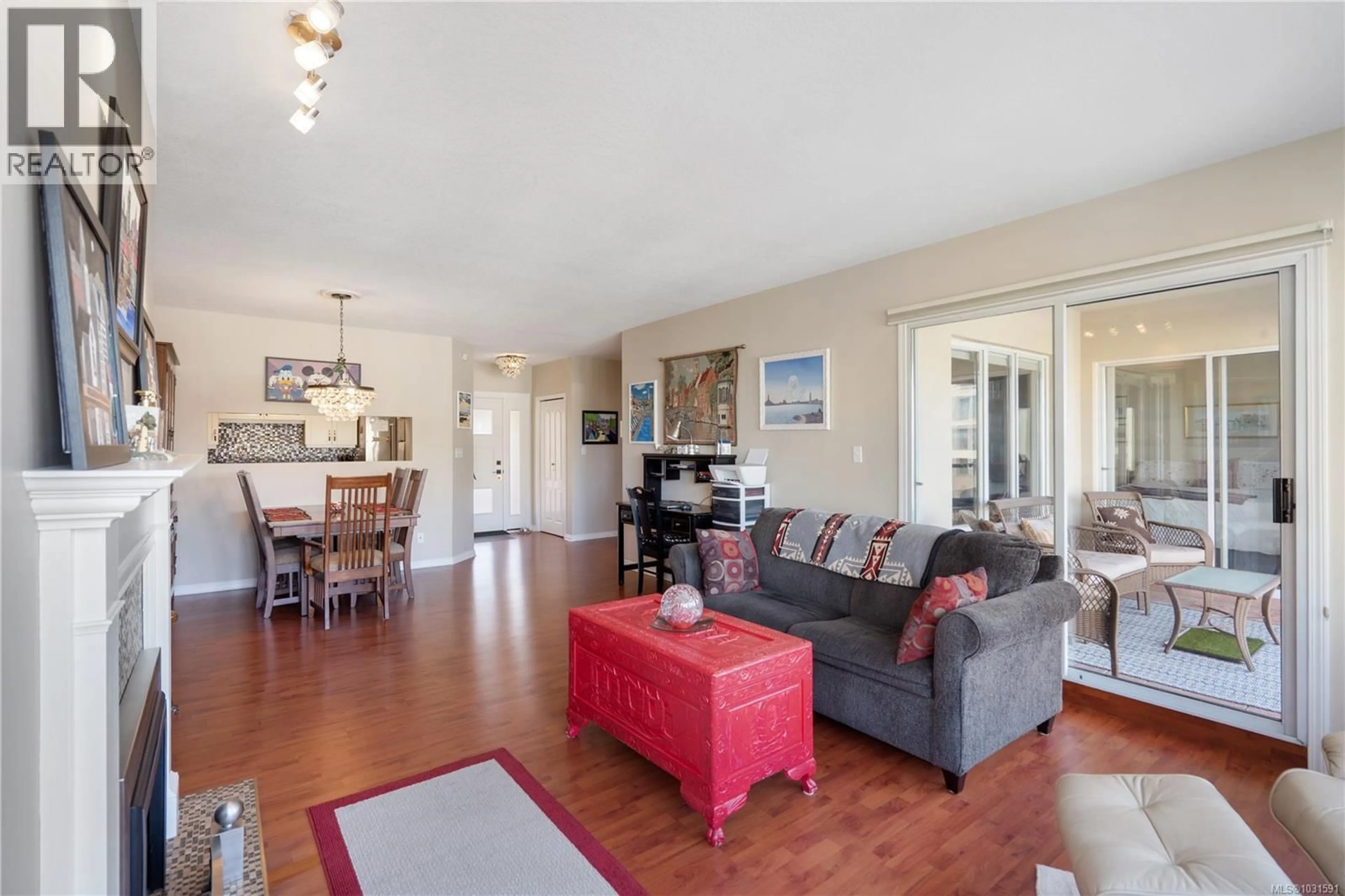 Living room with furniture, wood/laminate floor for 409 - 50 SONGHEES ROAD, Victoria British Columbia V9A7J4