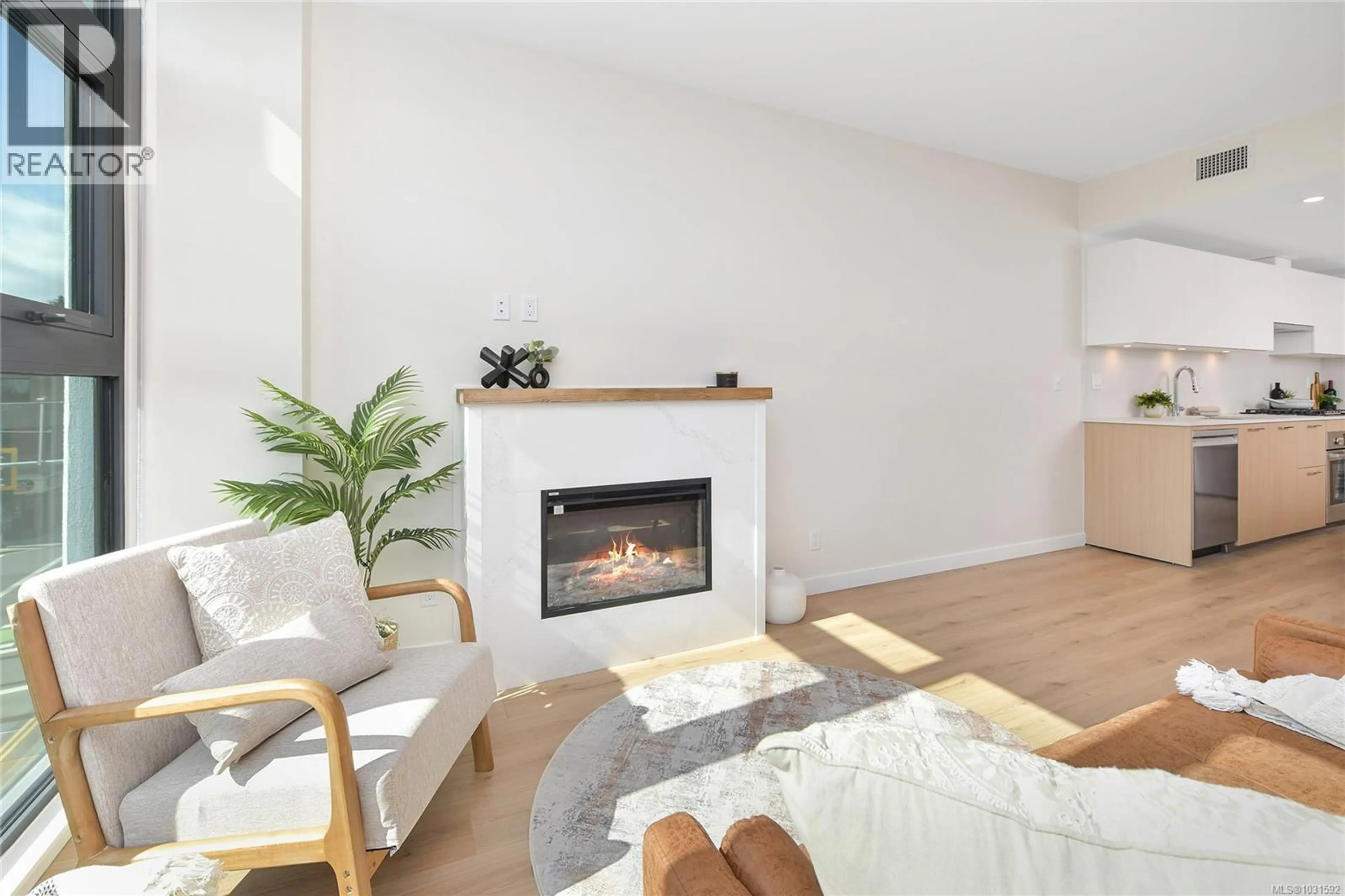 Living room with furniture, wood/laminate floor for 304 - 899 ESQUIMALT AVENUE, Esquimalt British Columbia V9A3M5