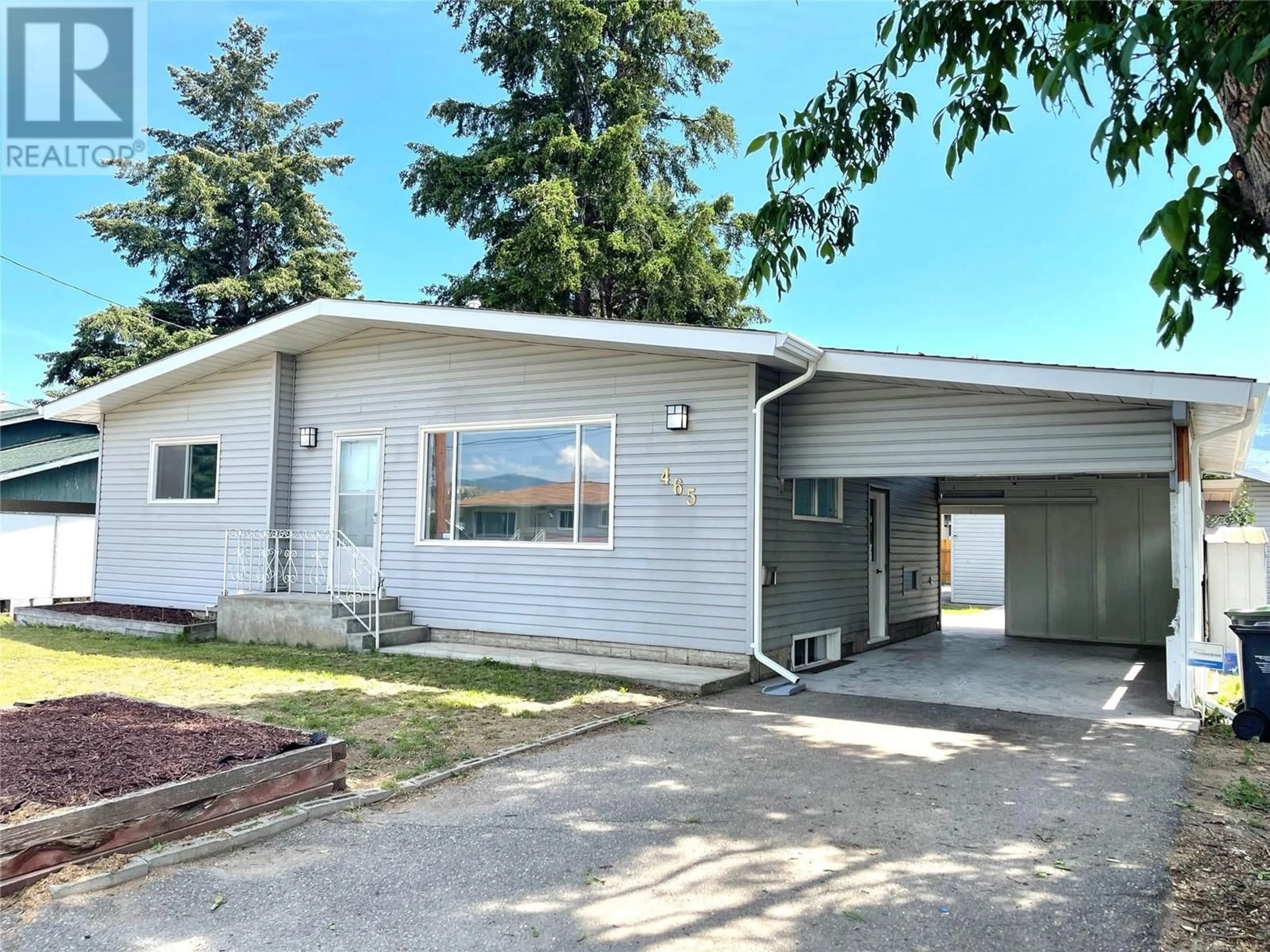 Home with vinyl exterior material, street for 465 DONHAUSER ROAD, Kelowna British Columbia V1X3G2