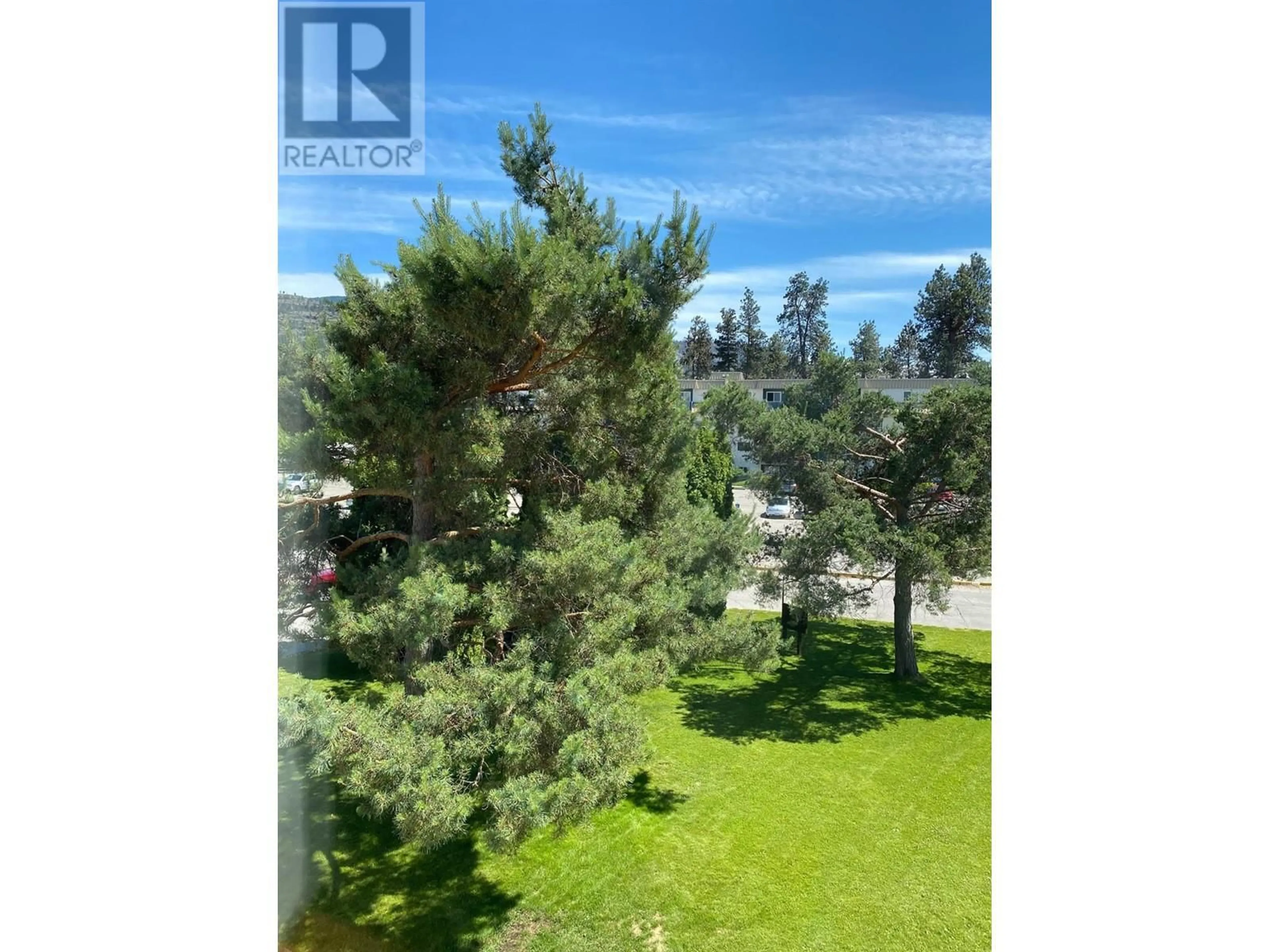A pic from outside/outdoor area/front of a property/back of a property/a pic from drone, forest/trees view for 205 - 150 SKAHA PLACE, Penticton British Columbia V2A7L1
