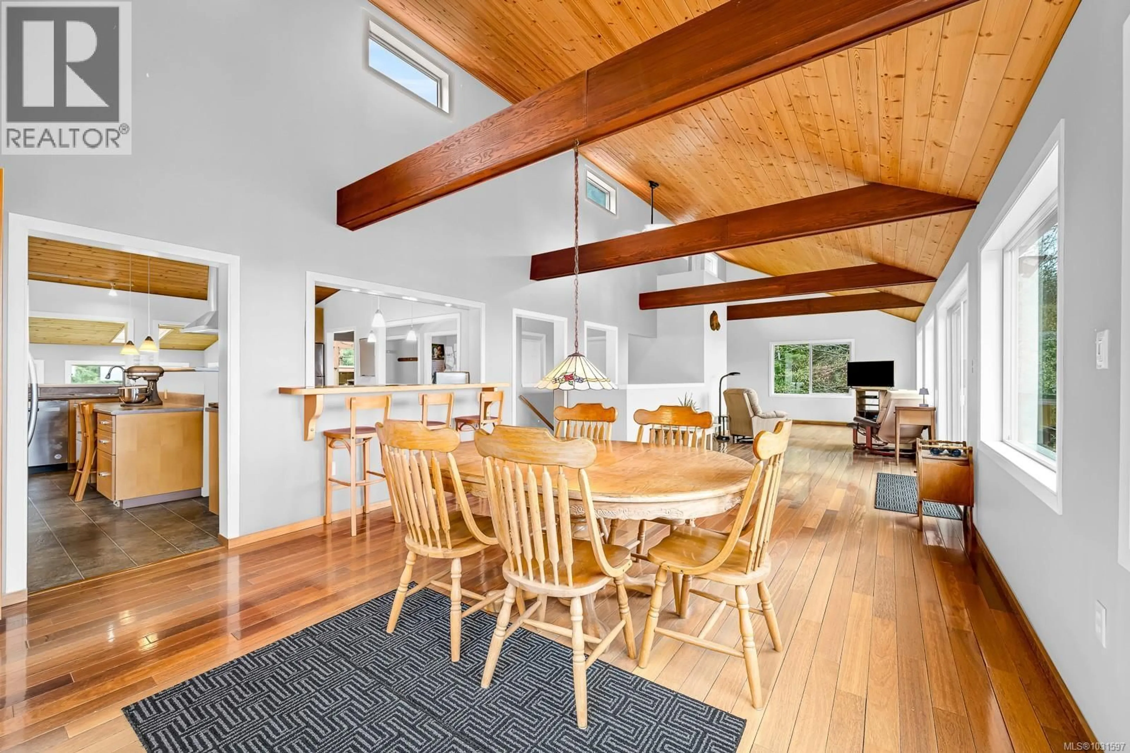 Open concept kitchen, wood/laminate floor for 8900 KEITH WAGNER WAY, Denman Island British Columbia V0R1T0