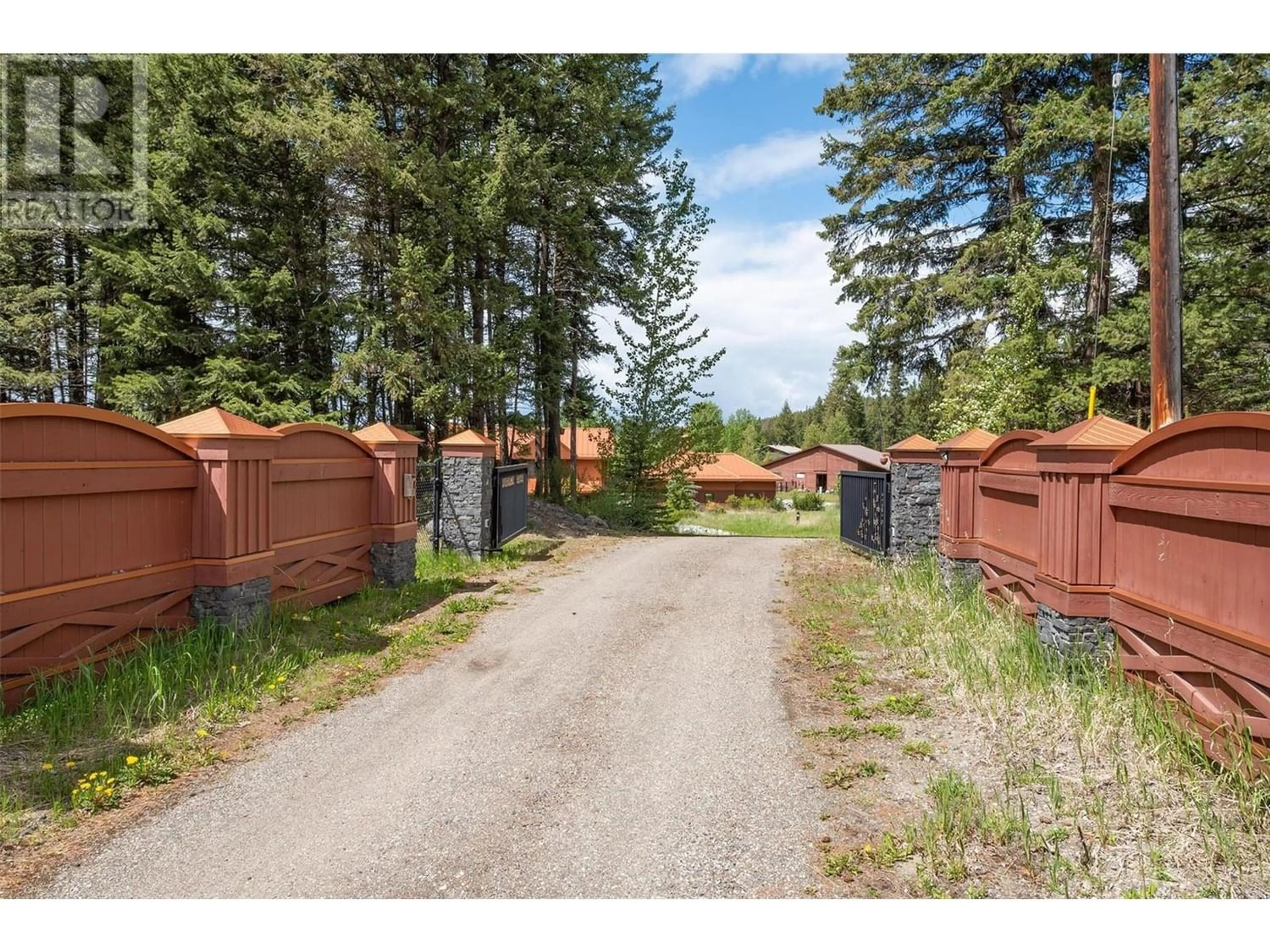 A pic from outside/outdoor area/front of a property/back of a property/a pic from drone, unknown for 1306 Huckleberry Road, Kelowna British Columbia V1P1M5