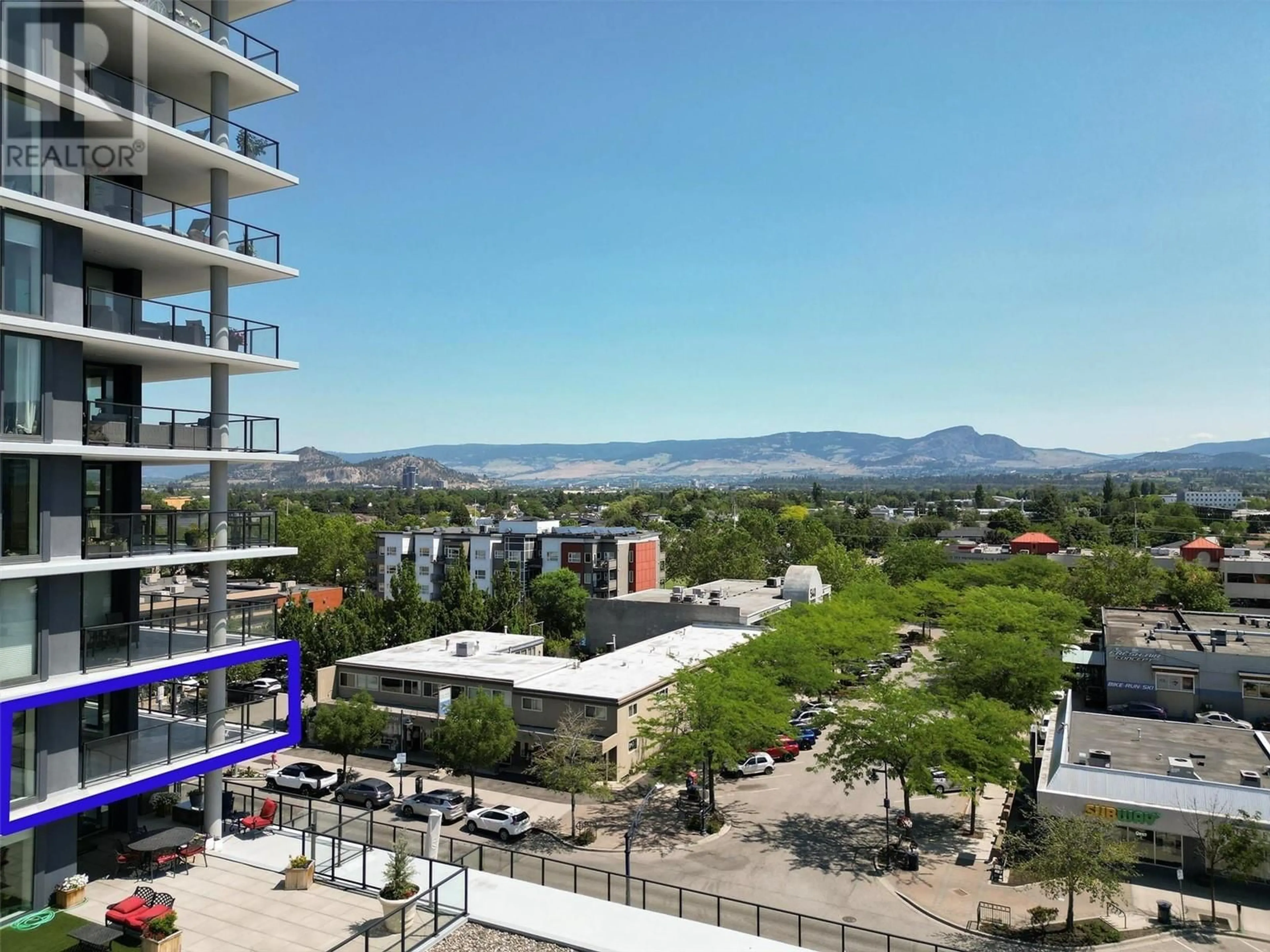 A pic from exterior of the house or condo, the view of city buildings for 485 Groves Avenue Unit# 502, Kelowna British Columbia V1Y4Y6