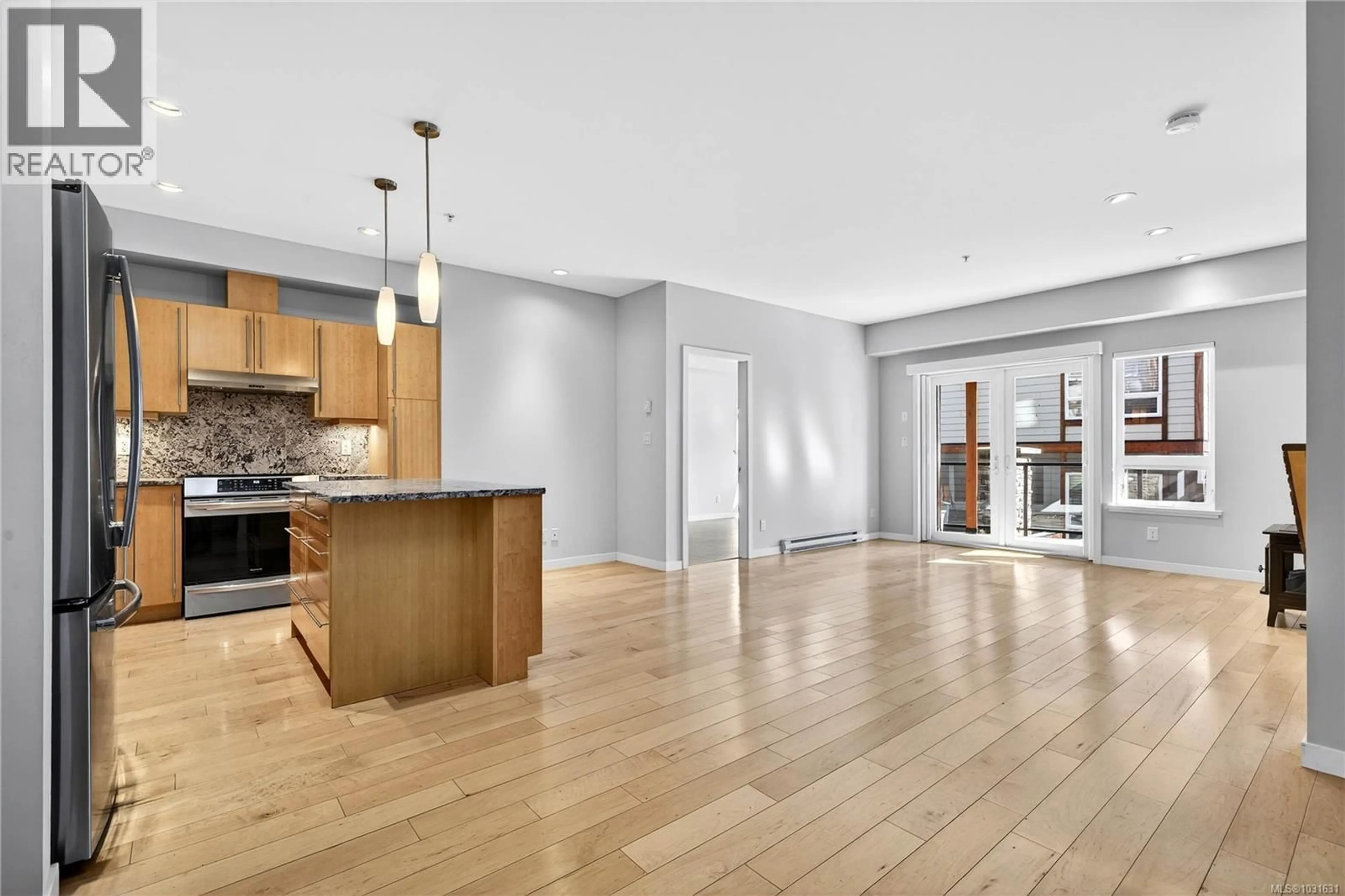Open concept kitchen, wood/laminate floor for 202 - 6591 LINCROFT ROAD, Sooke British Columbia V9Z1M2