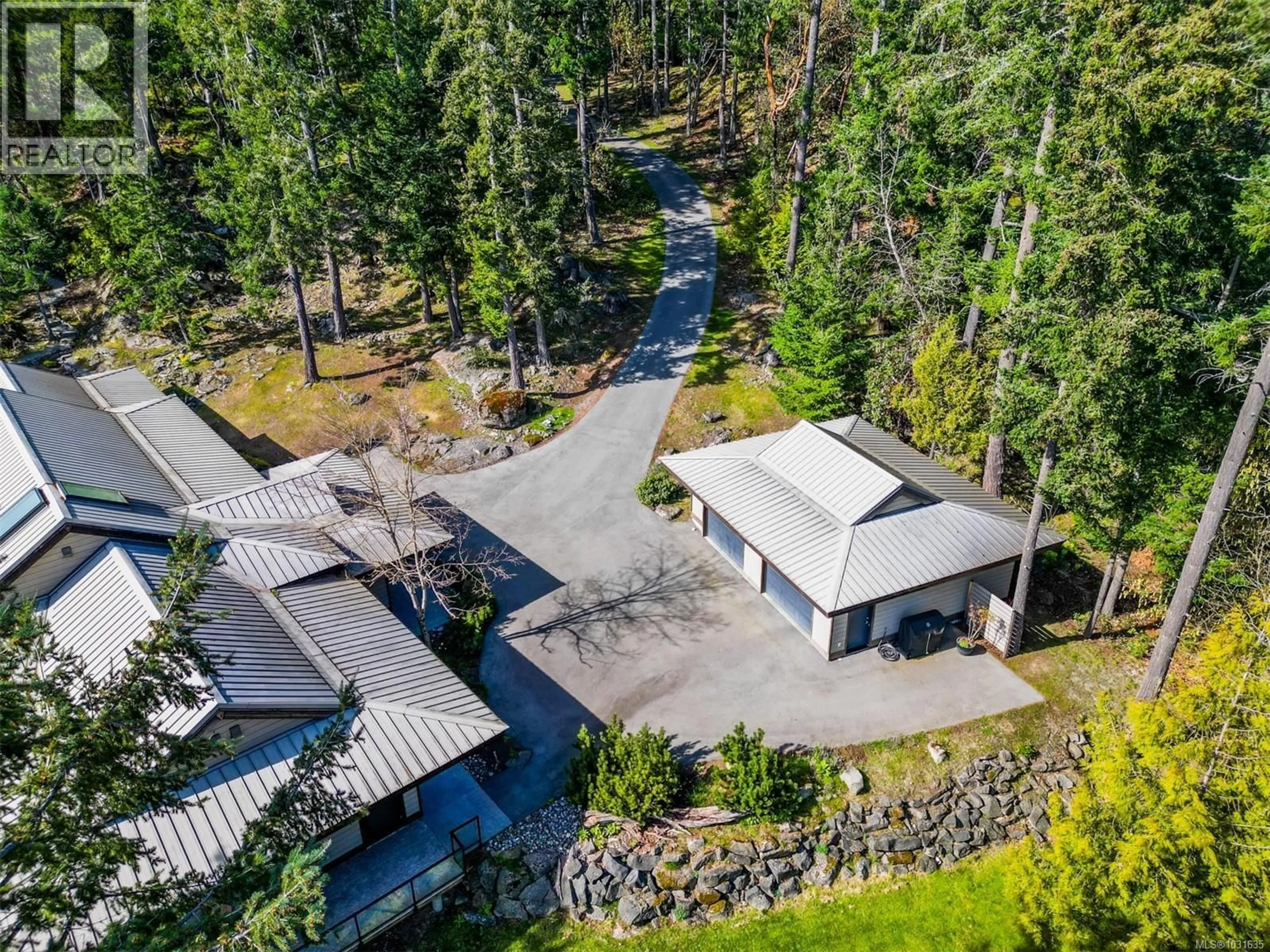 A pic from outside/outdoor area/front of a property/back of a property/a pic from drone, forest/trees view for 1369 MACKINNON ROAD, Pender Island British Columbia V0N2M1