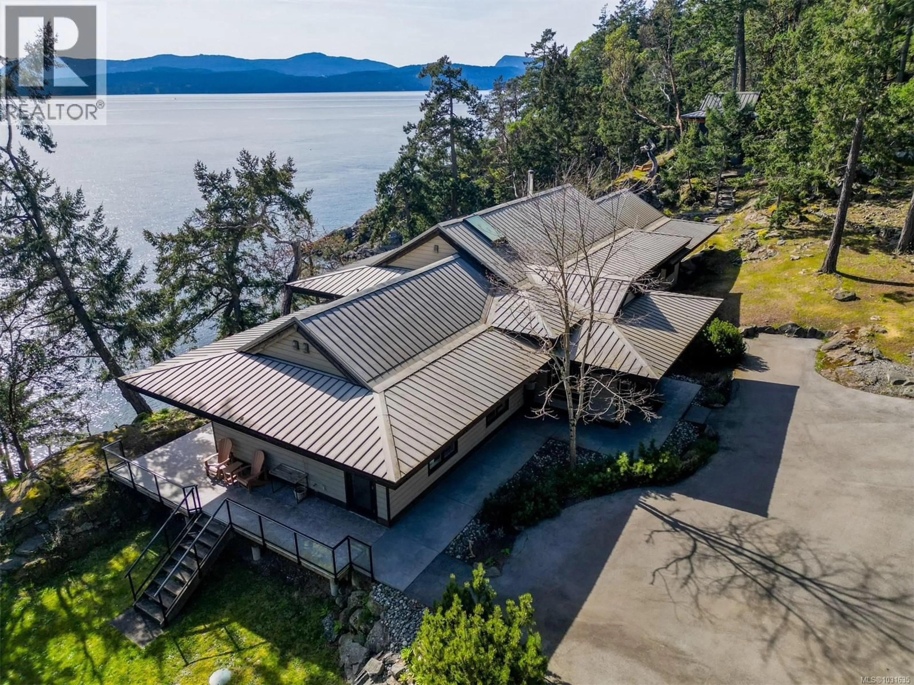 A pic from outside/outdoor area/front of a property/back of a property/a pic from drone, water/lake/river/ocean view for 1369 MACKINNON ROAD, Pender Island British Columbia V0N2M1