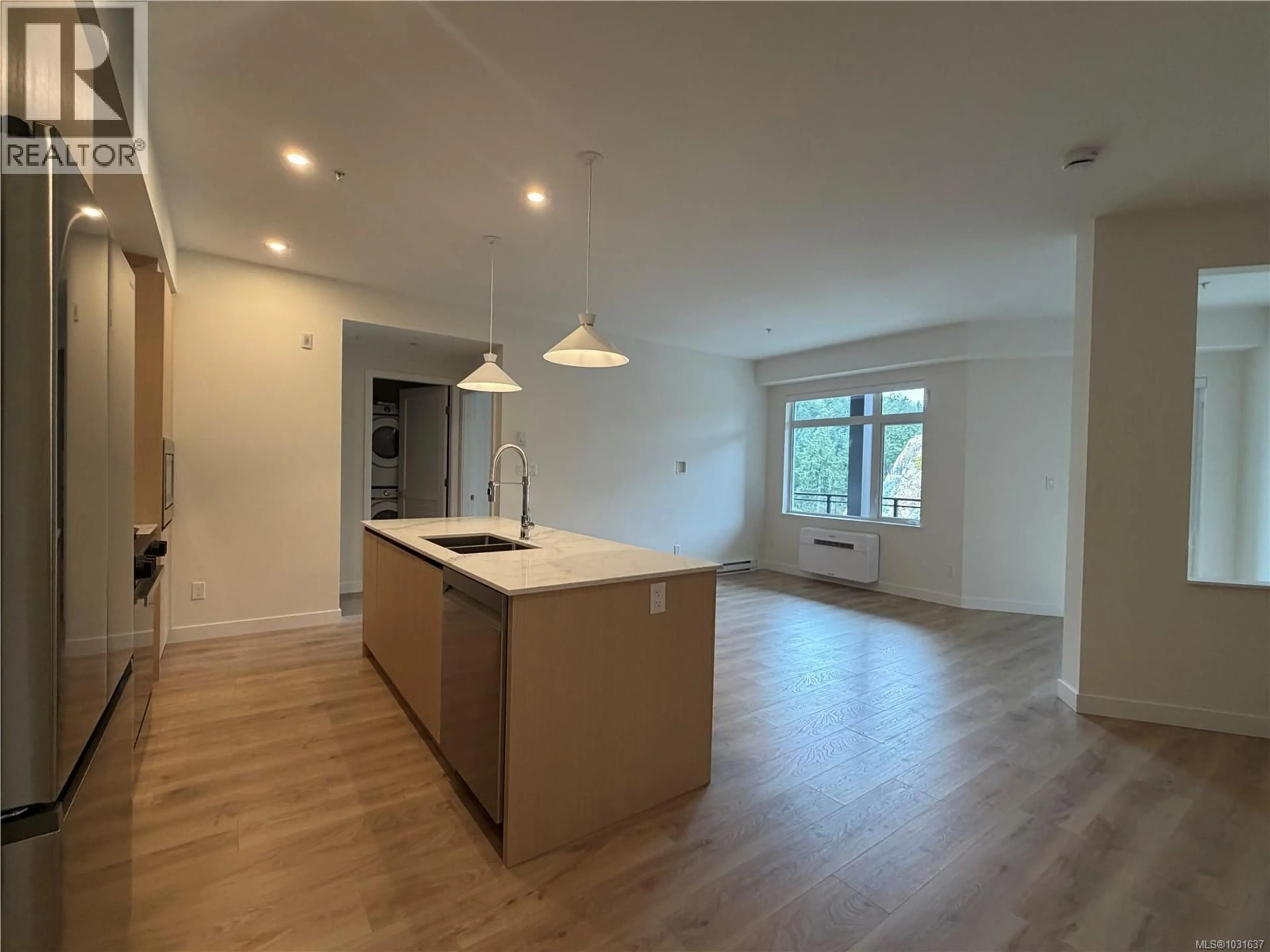 Open concept kitchen, wood/laminate floor for 401 - 2000 WEST PARK LANE, View Royal British Columbia V9B3R7