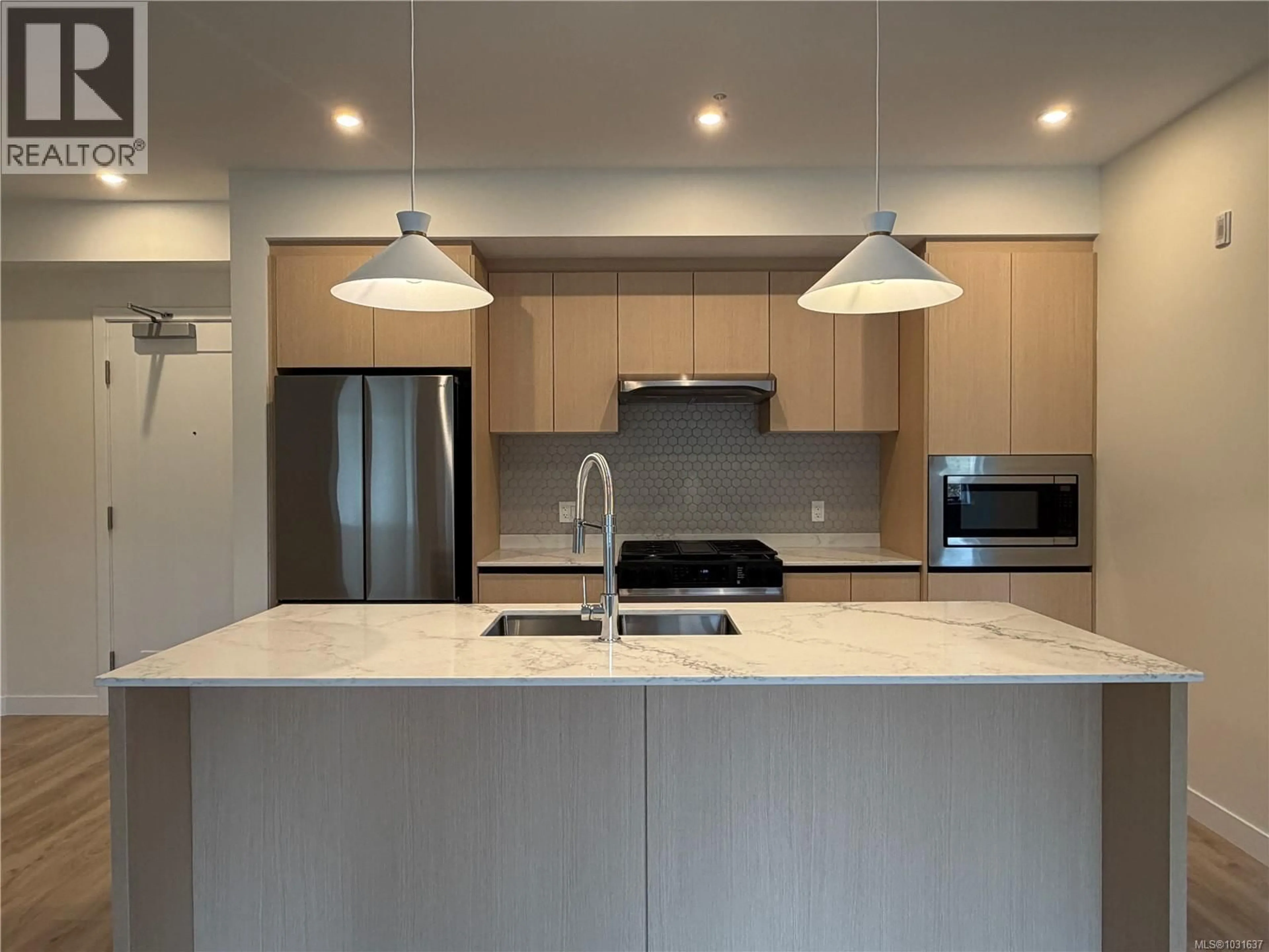 Open concept kitchen, wood/laminate floor for 401 - 2000 WEST PARK LANE, View Royal British Columbia V9B3R7