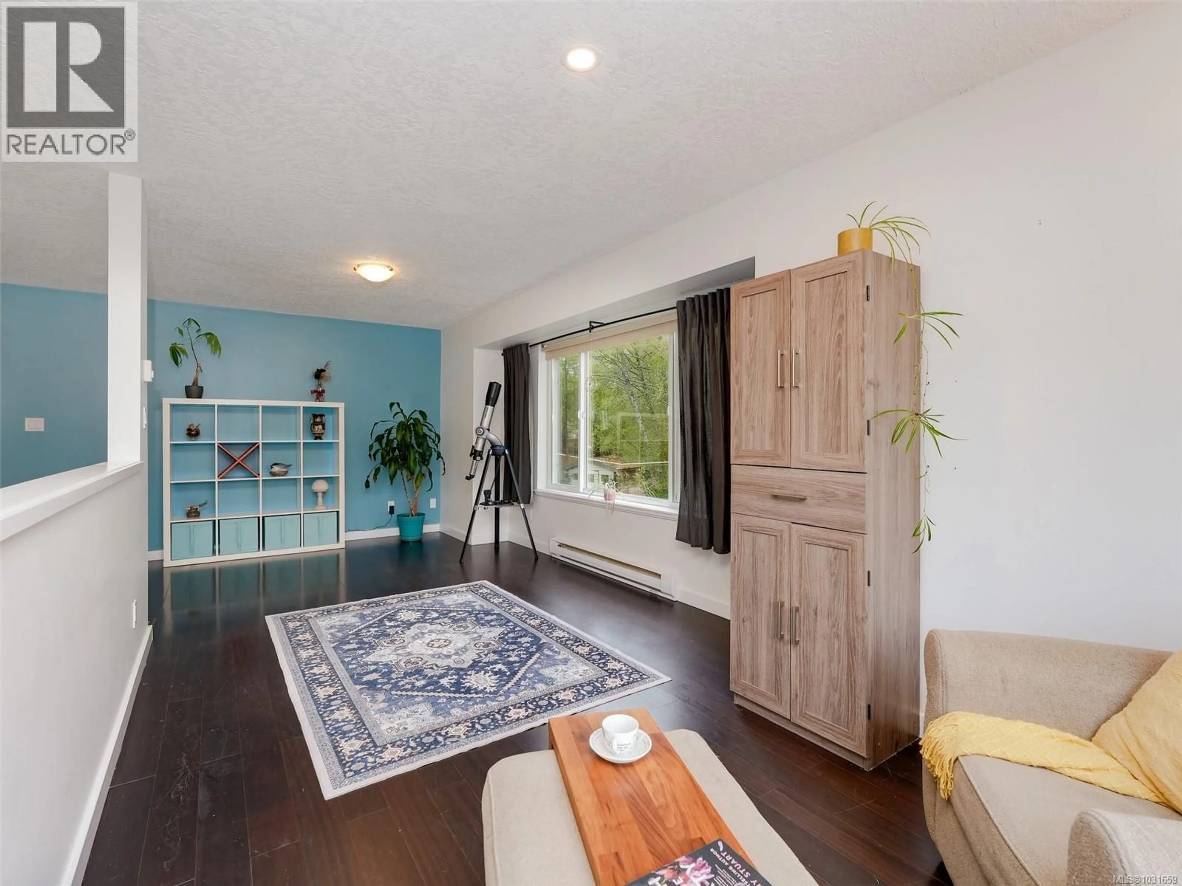 Living room with furniture, wood/laminate floor for 6894 BEATON ROAD, Sooke British Columbia V9Z0M3