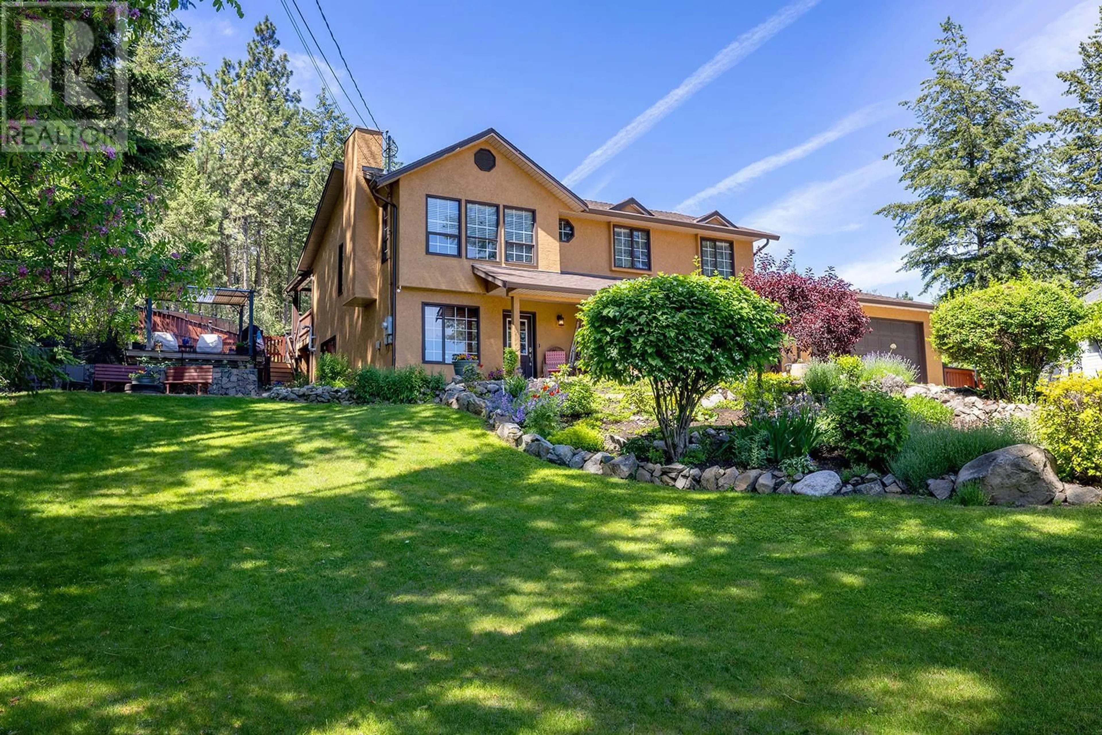 A pic from exterior of the house or condo, the fenced backyard for 10590 Long Road, Lake Country British Columbia V4V1N7