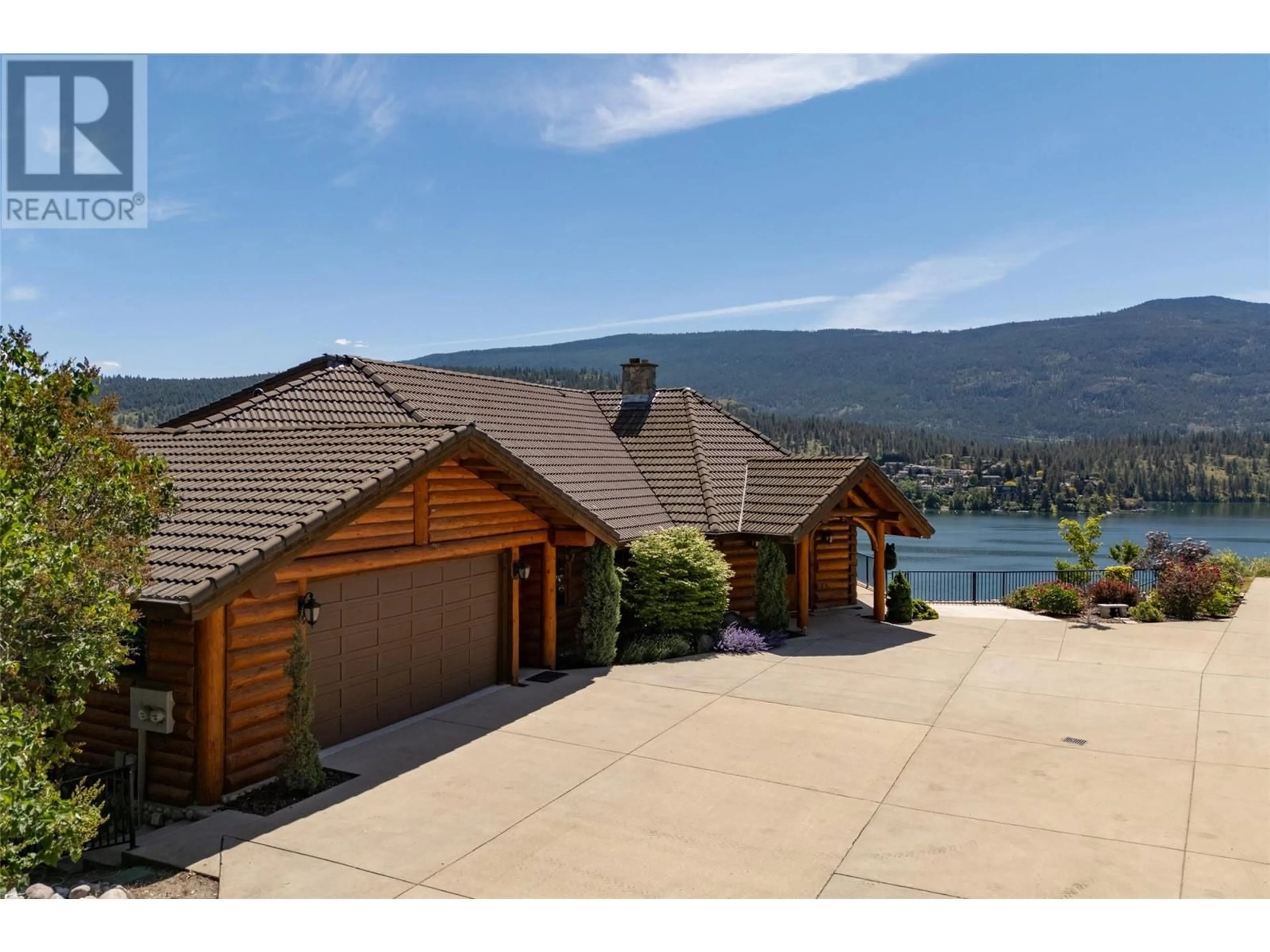 A pic from outside/outdoor area/front of a property/back of a property/a pic from drone, water/lake/river/ocean view for 3 - 55 KALAMALKA LAKEVIEW DRIVE, Vernon British Columbia V1H1L7