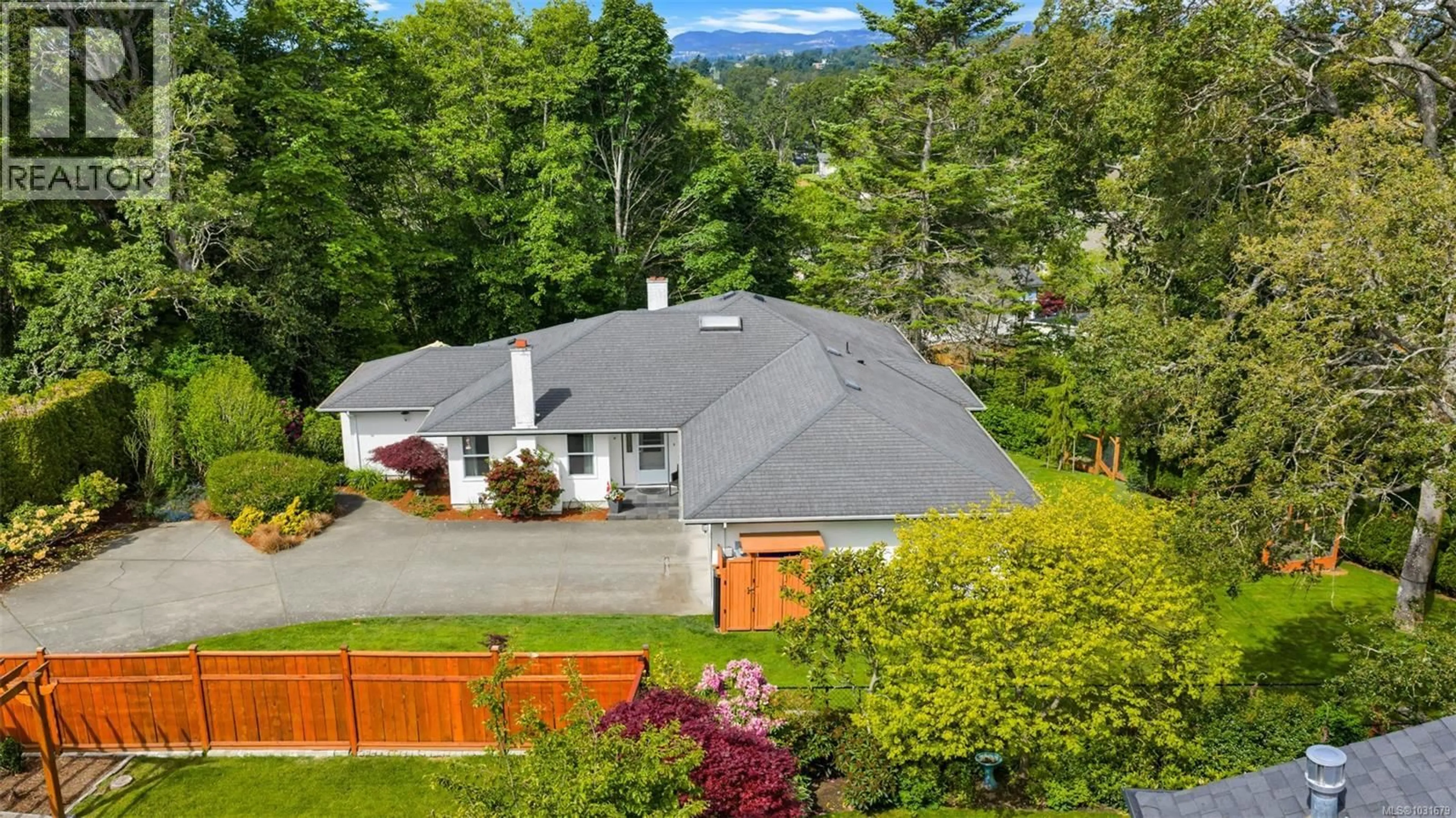 A pic from outside/outdoor area/front of a property/back of a property/a pic from drone, mountain view for 4008 BOW ROAD, Saanich British Columbia V8N3B1
