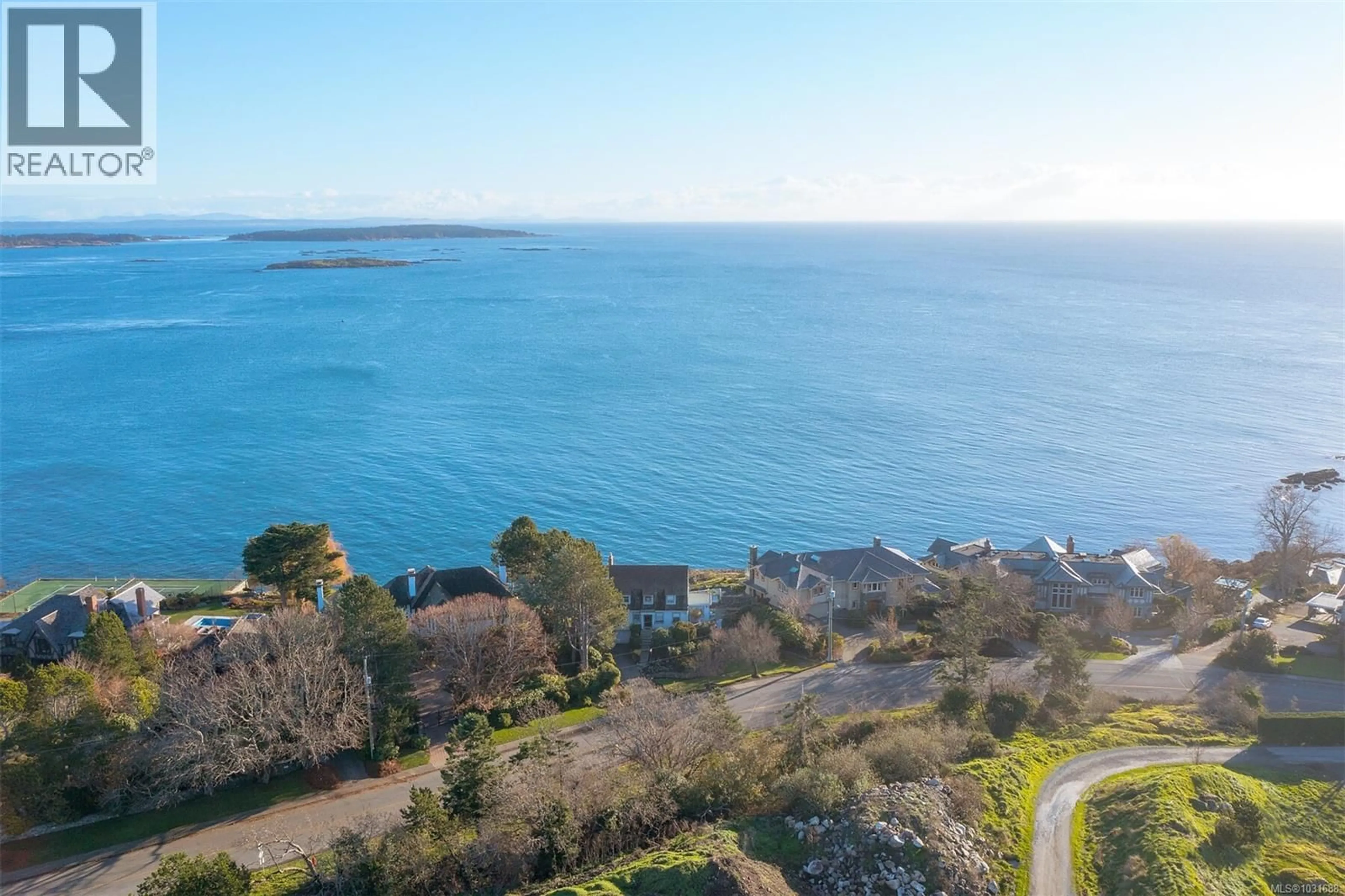 A pic from outside/outdoor area/front of a property/back of a property/a pic from drone, water/lake/river/ocean view for 987 BEACH DRIVE, Oak Bay British Columbia V8S2N2