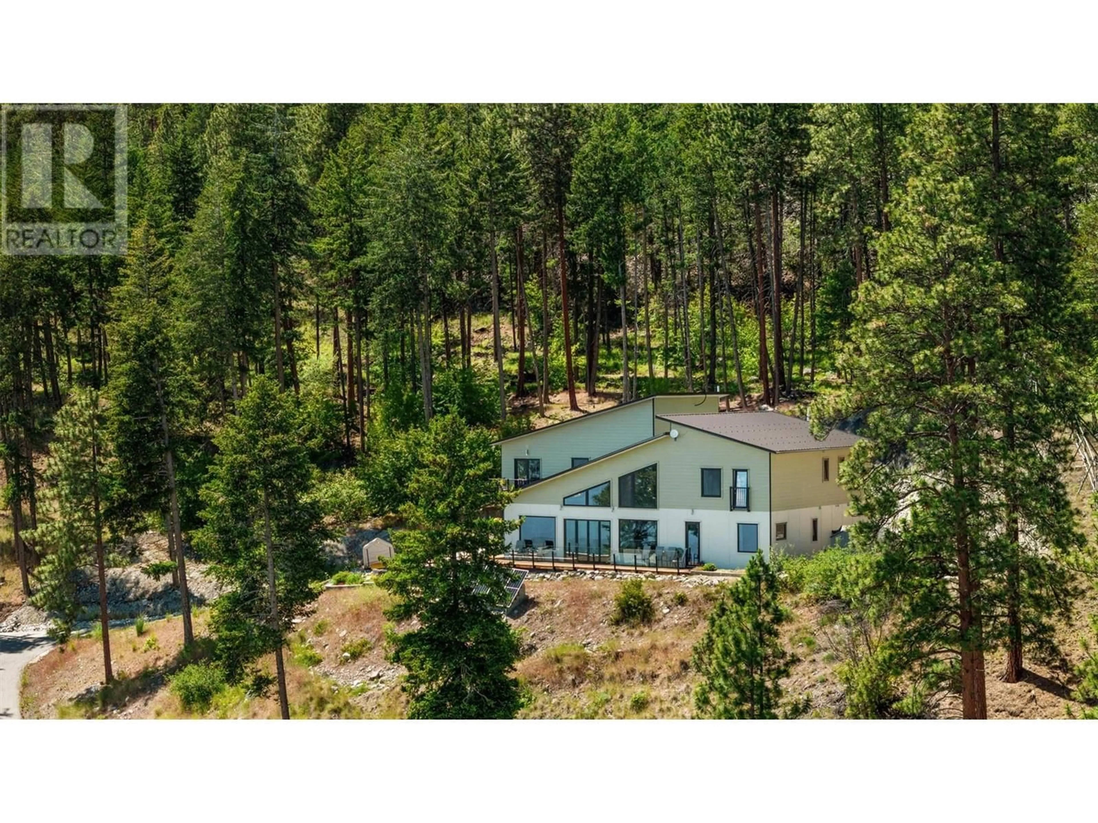 A pic from outside/outdoor area/front of a property/back of a property/a pic from drone, forest/trees view for 6131 SEYMOURE LANE, Peachland British Columbia V0H1X4