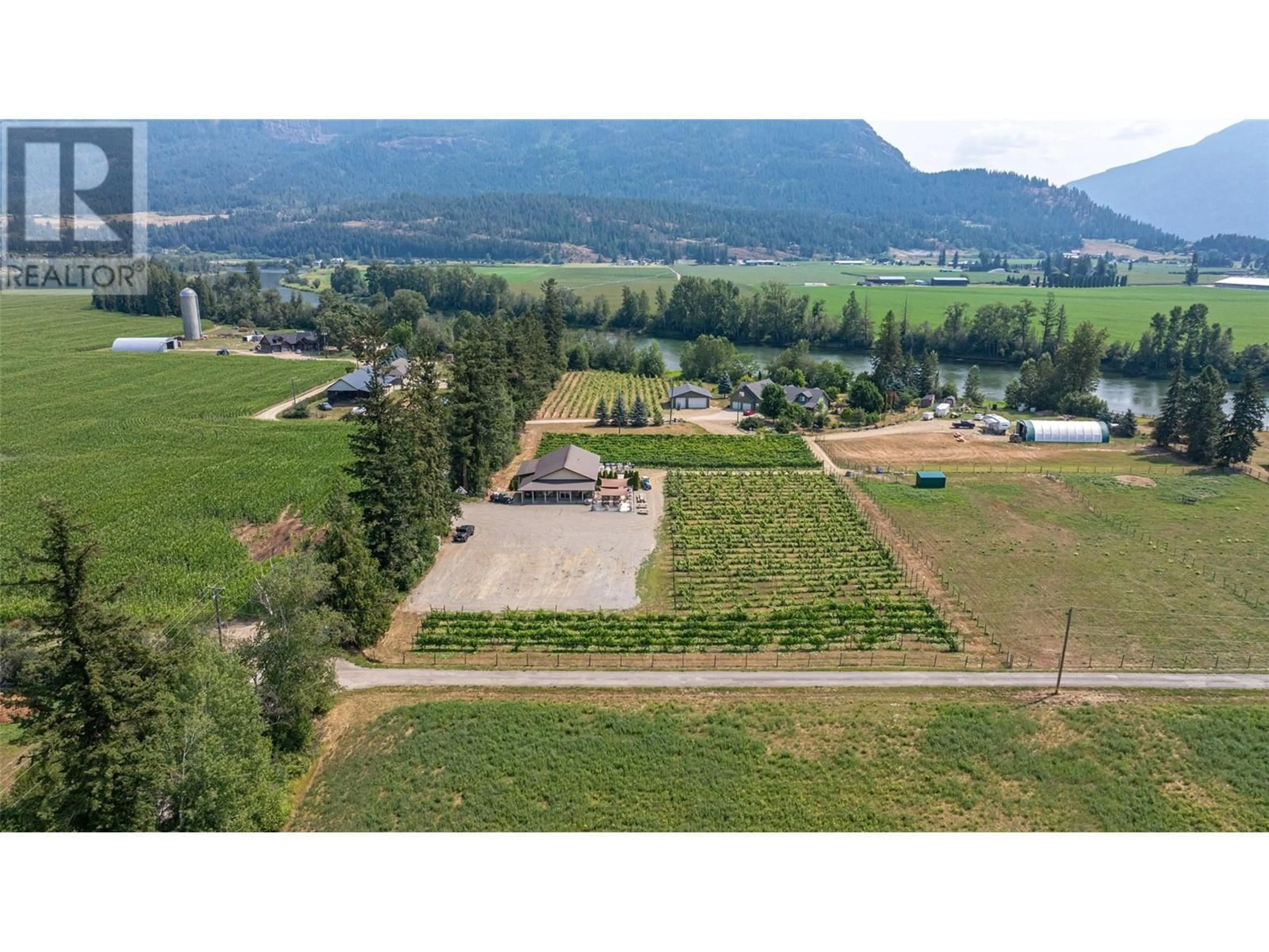 A pic from outside/outdoor area/front of a property/back of a property/a pic from drone, mountain view for 70 WATERSIDE ROAD, Enderby British Columbia V0E1V3