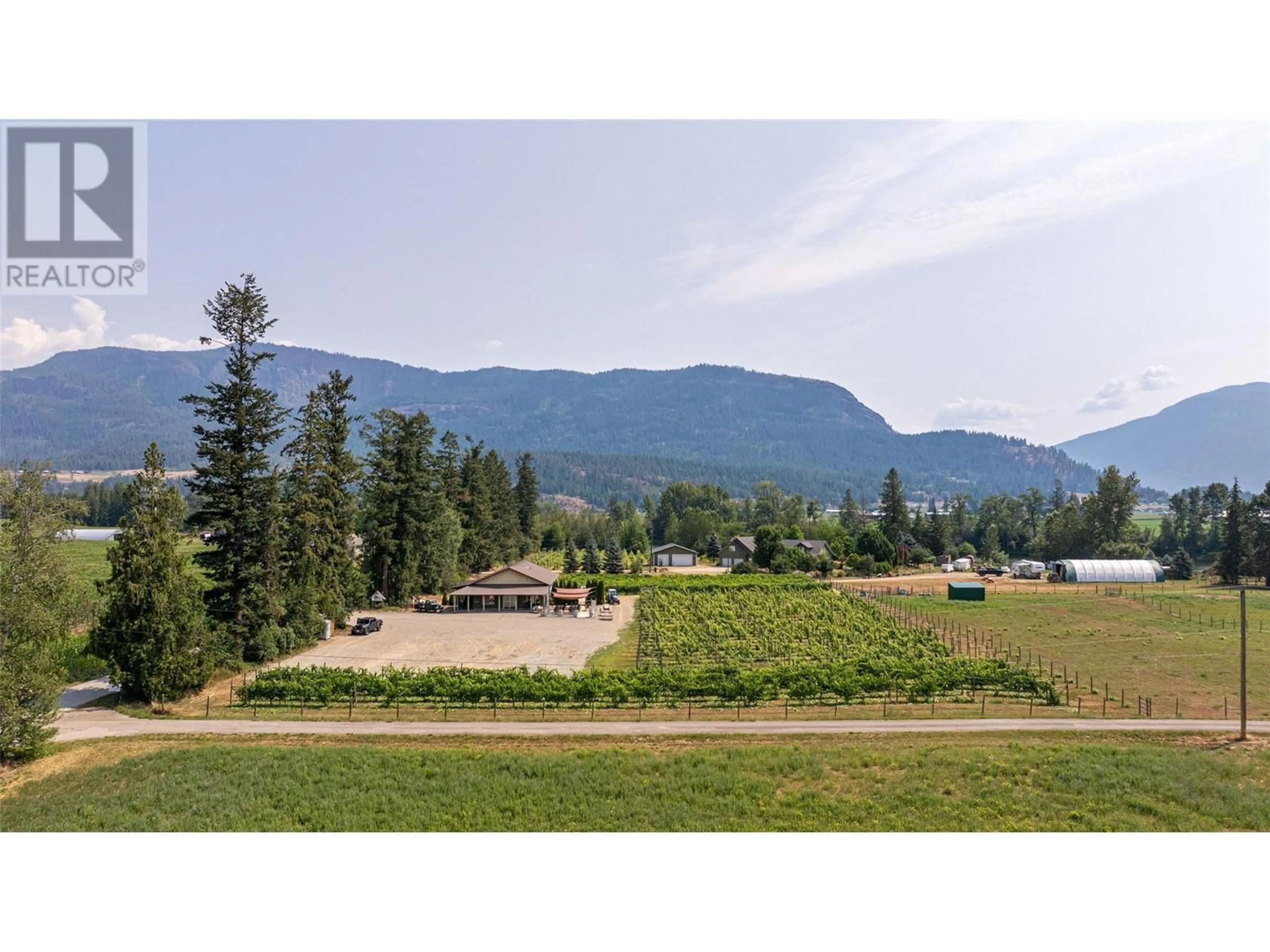 A pic from outside/outdoor area/front of a property/back of a property/a pic from drone, mountain view for 70 WATERSIDE ROAD, Enderby British Columbia V0E1V3
