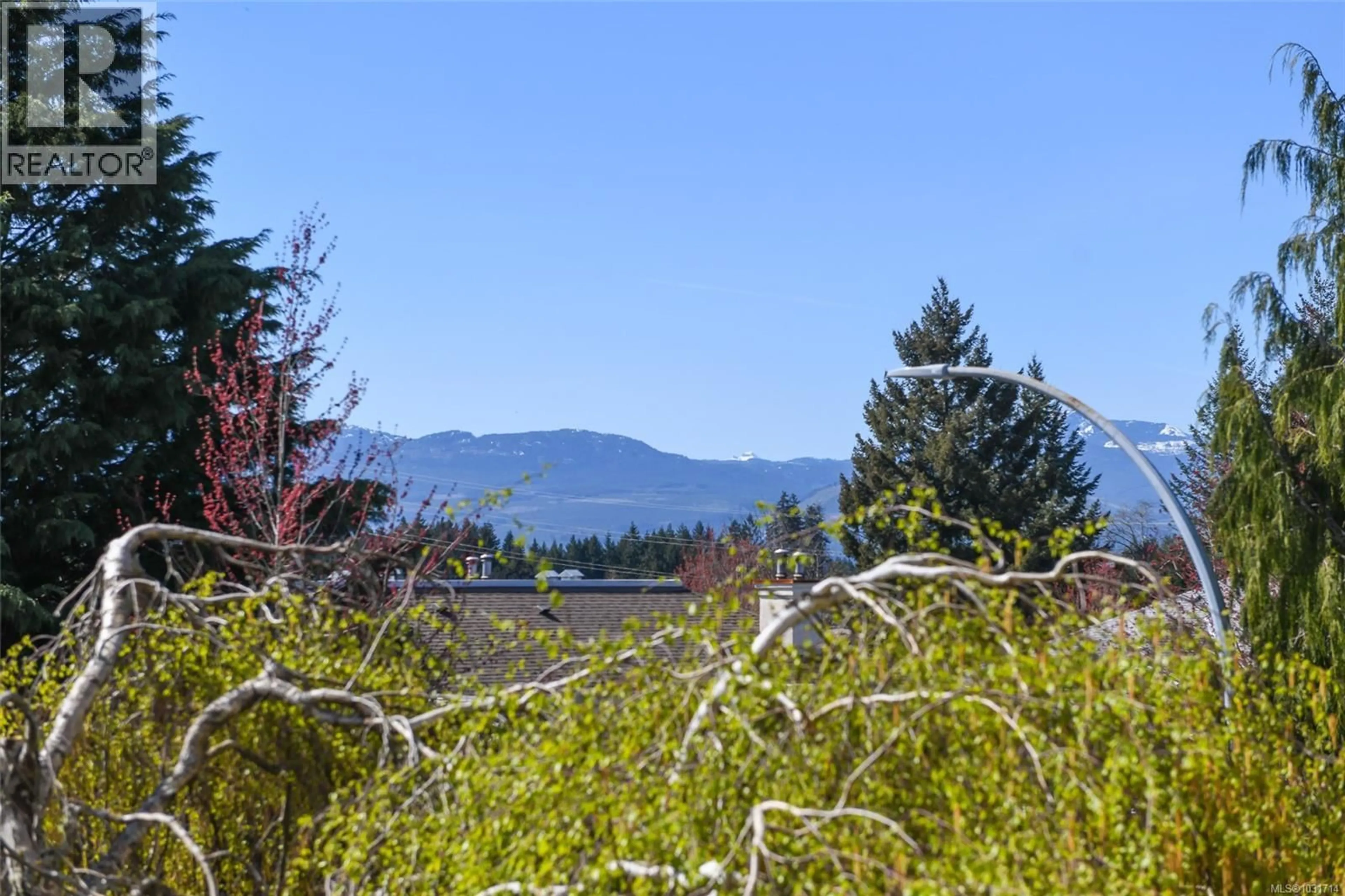 A pic from outside/outdoor area/front of a property/back of a property/a pic from drone, forest/trees view for 205 - 4692 ALDERWOOD PLACE, Courtenay British Columbia V9N9A1