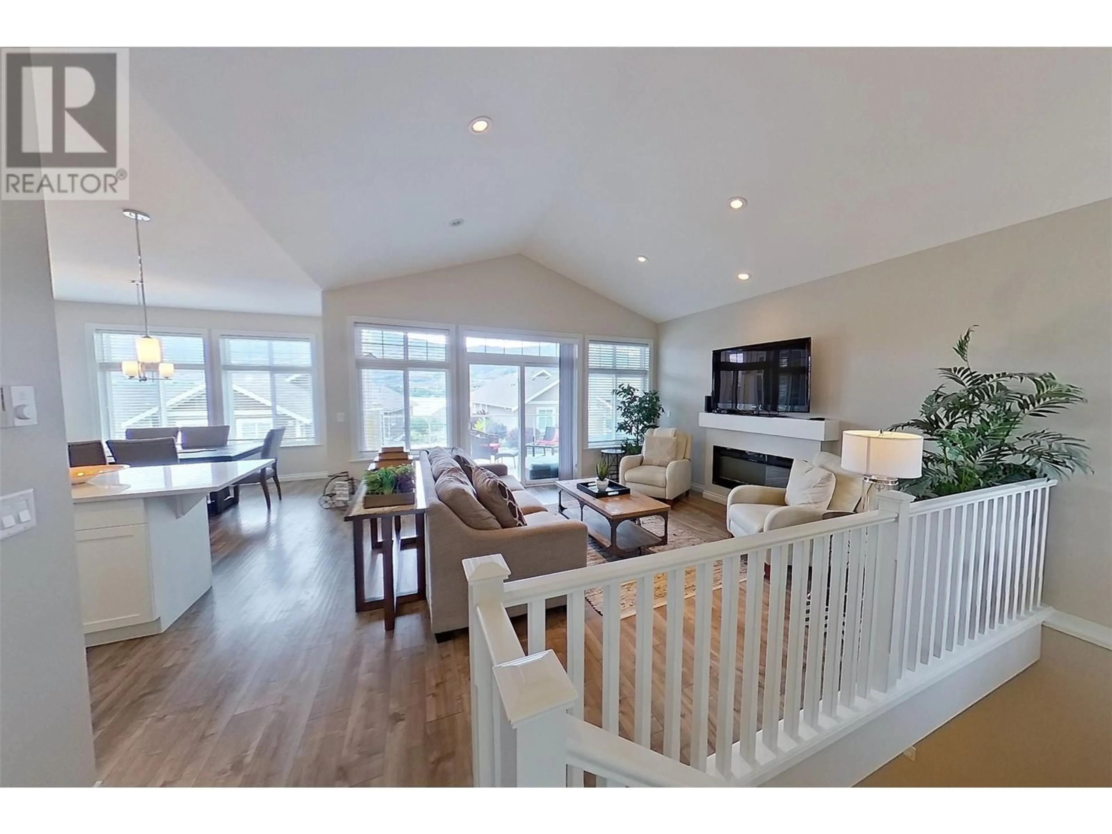 Living room with furniture, wood/laminate floor for 209 - 2450 RADIO TOWER ROAD, Oliver British Columbia V0H1T1