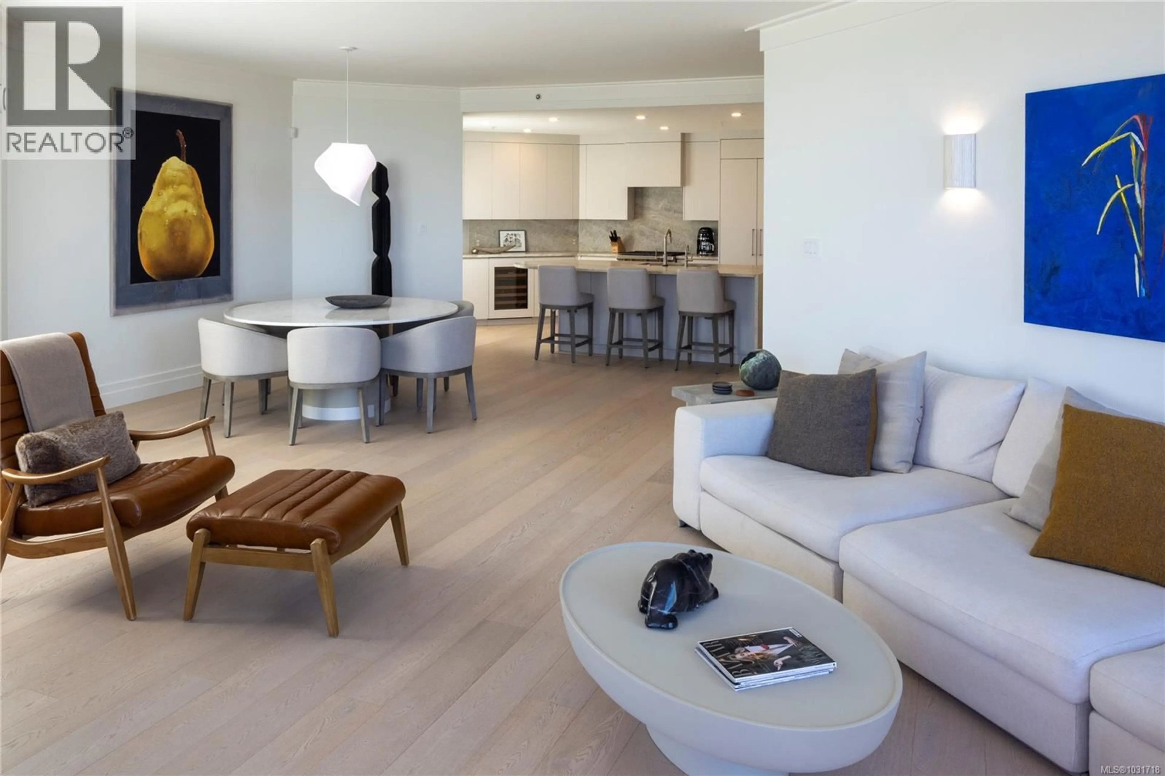 Living room with furniture, wood/laminate floor for 104 - 1284 BEACH DRIVE, Oak Bay British Columbia V8S2N3