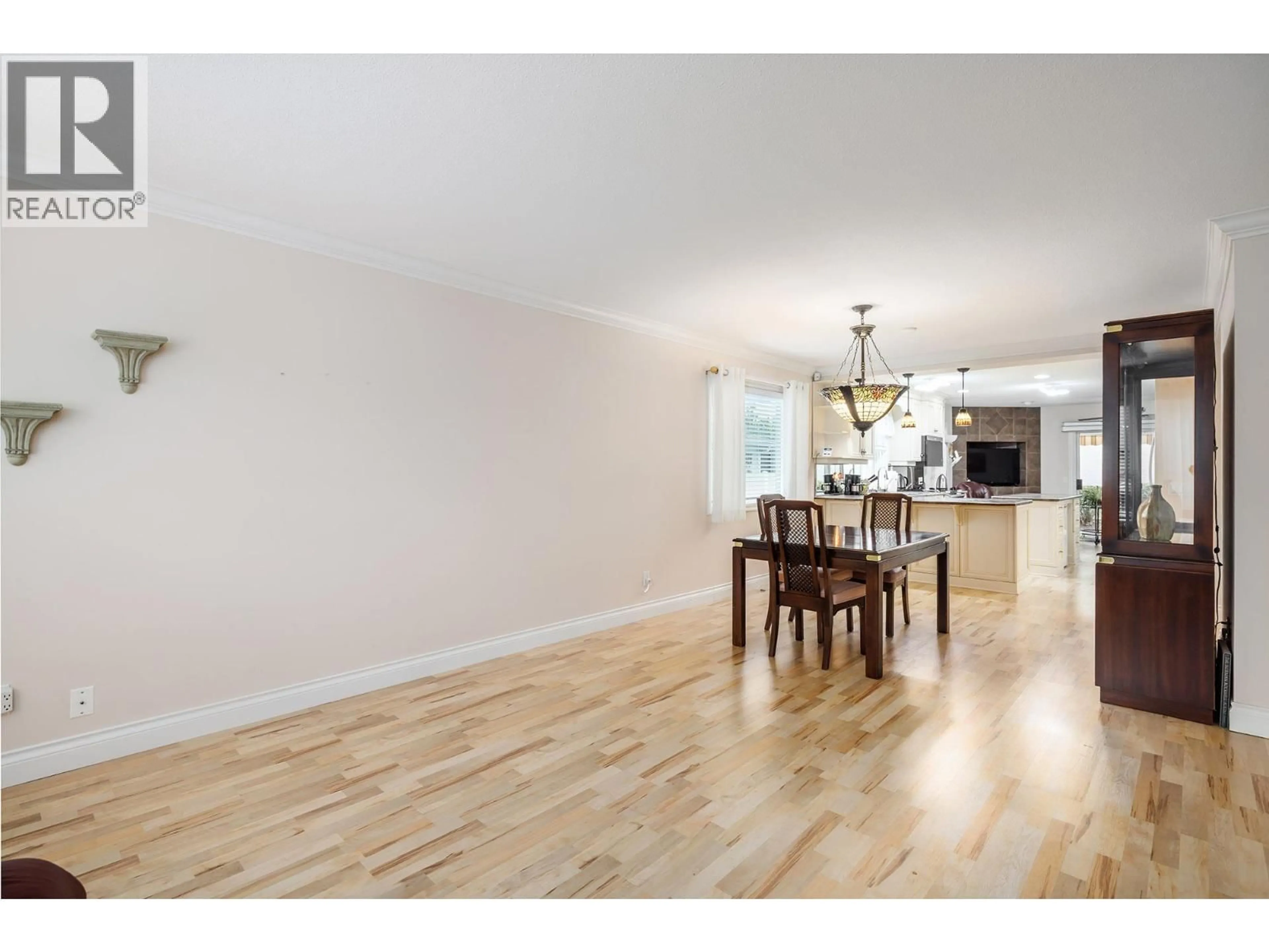 Open concept kitchen, wood/laminate floor for 55 - 615 GLENMEADOWS ROAD, Kelowna British Columbia V1V1N9