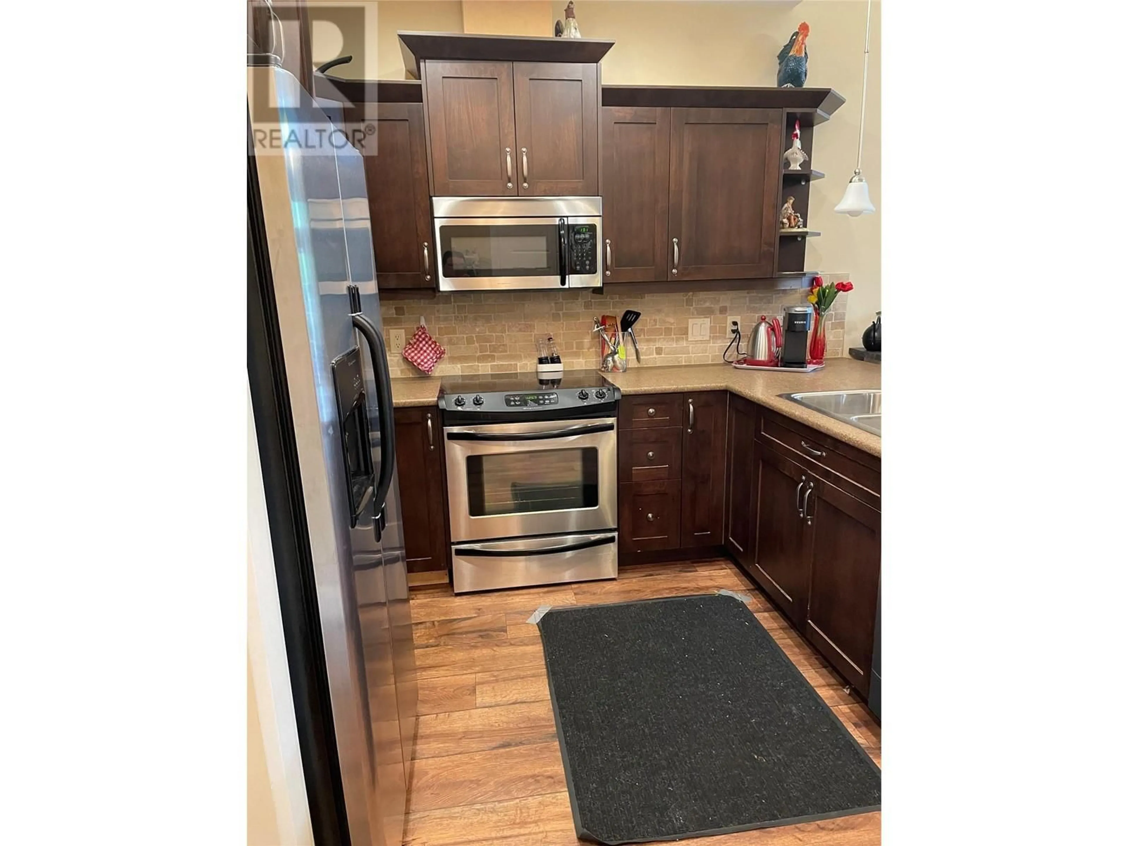 Standard kitchen, wood floors for 9100 Mackie Drive Unit# 212, Coldstream British Columbia V1B1G9