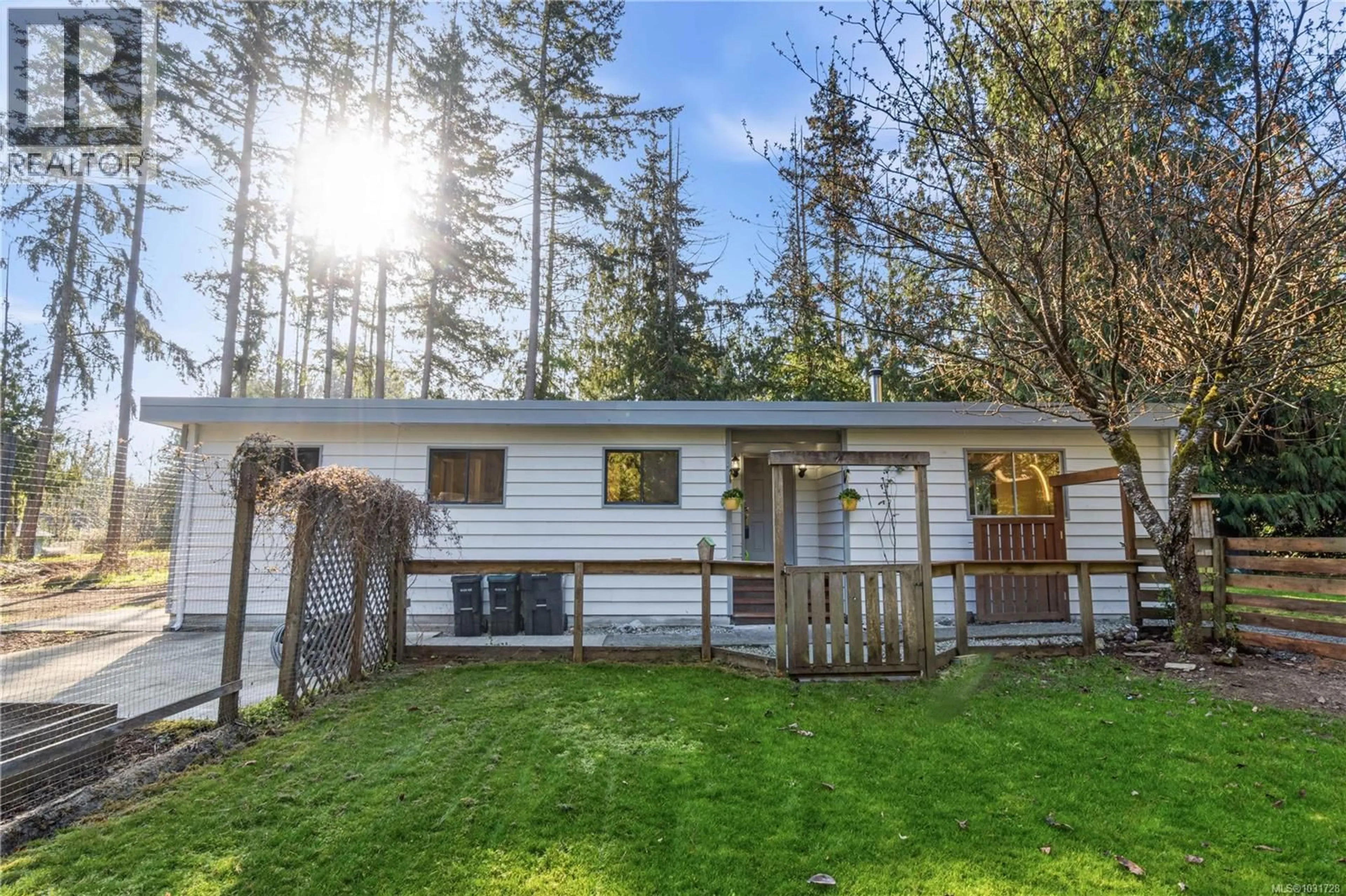 Home with vinyl exterior material, forest/trees view for 1007 FABRICK DRIVE, Qualicum Beach British Columbia V9K1M9