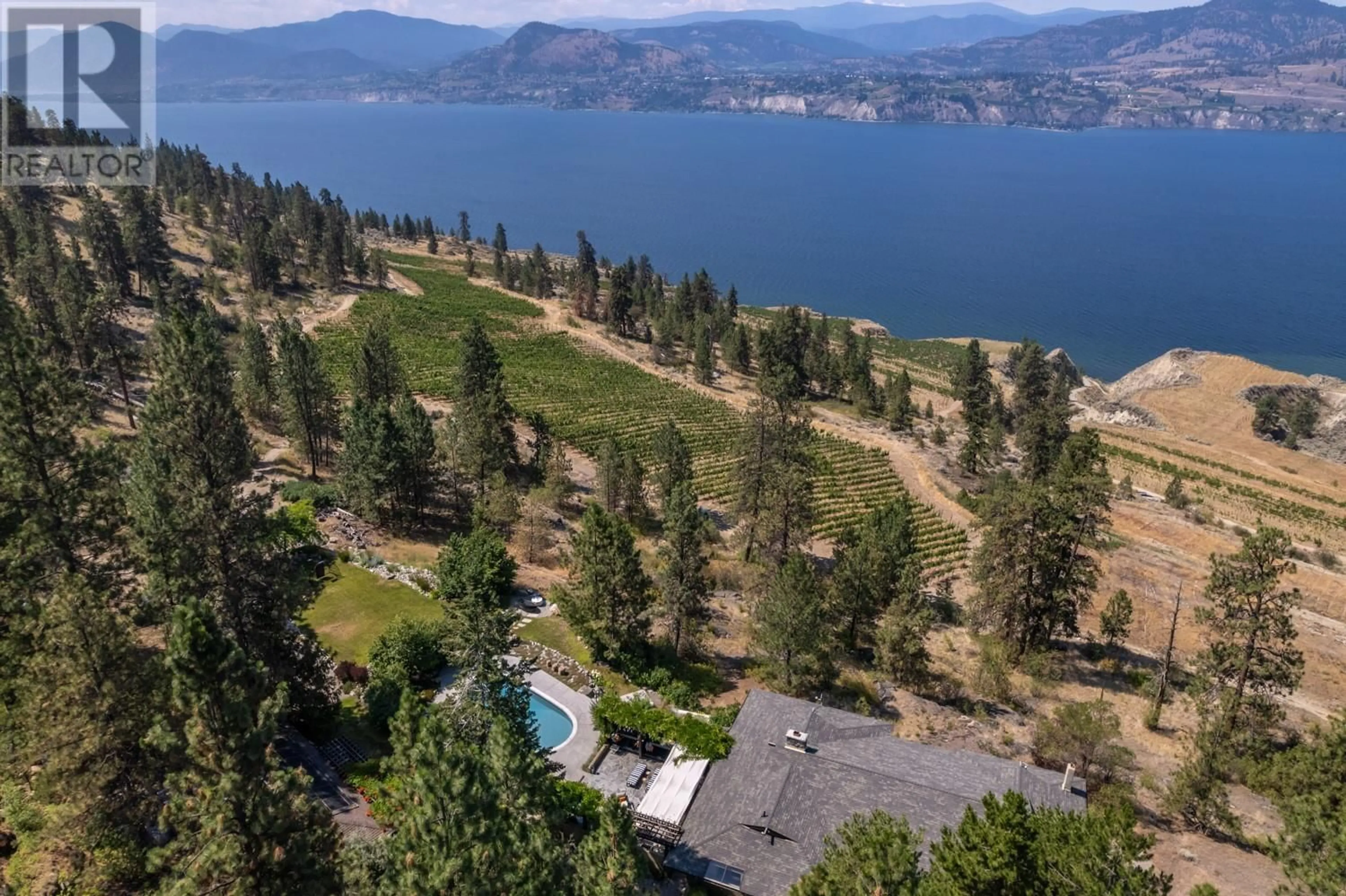 A pic from outside/outdoor area/front of a property/back of a property/a pic from drone, water/lake/river/ocean view for 6301 North Naramata Road, Naramata British Columbia V0H1N1