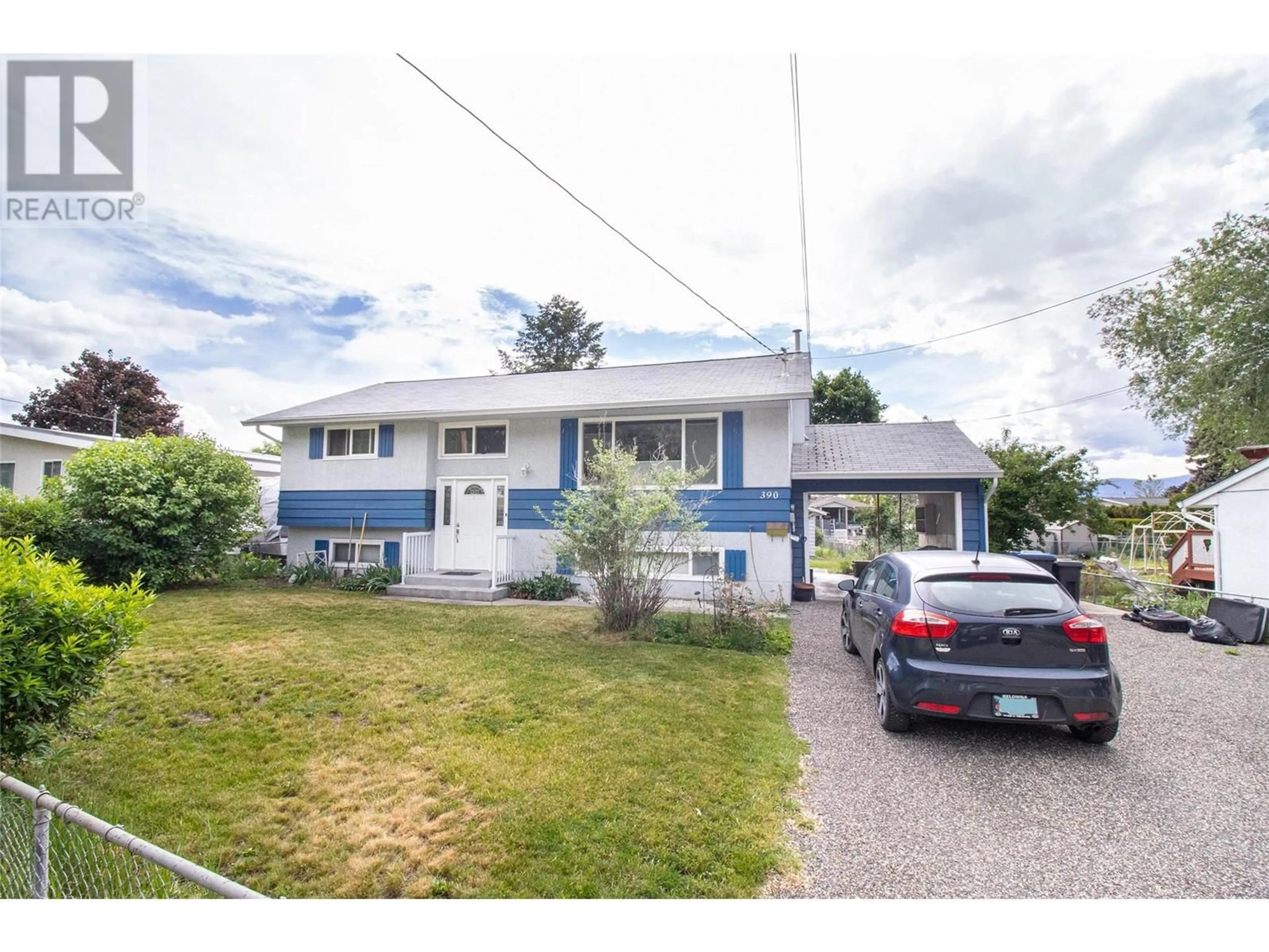 Frontside or backside of a home for 390 Dell Road, Kelowna British Columbia V1X3P8