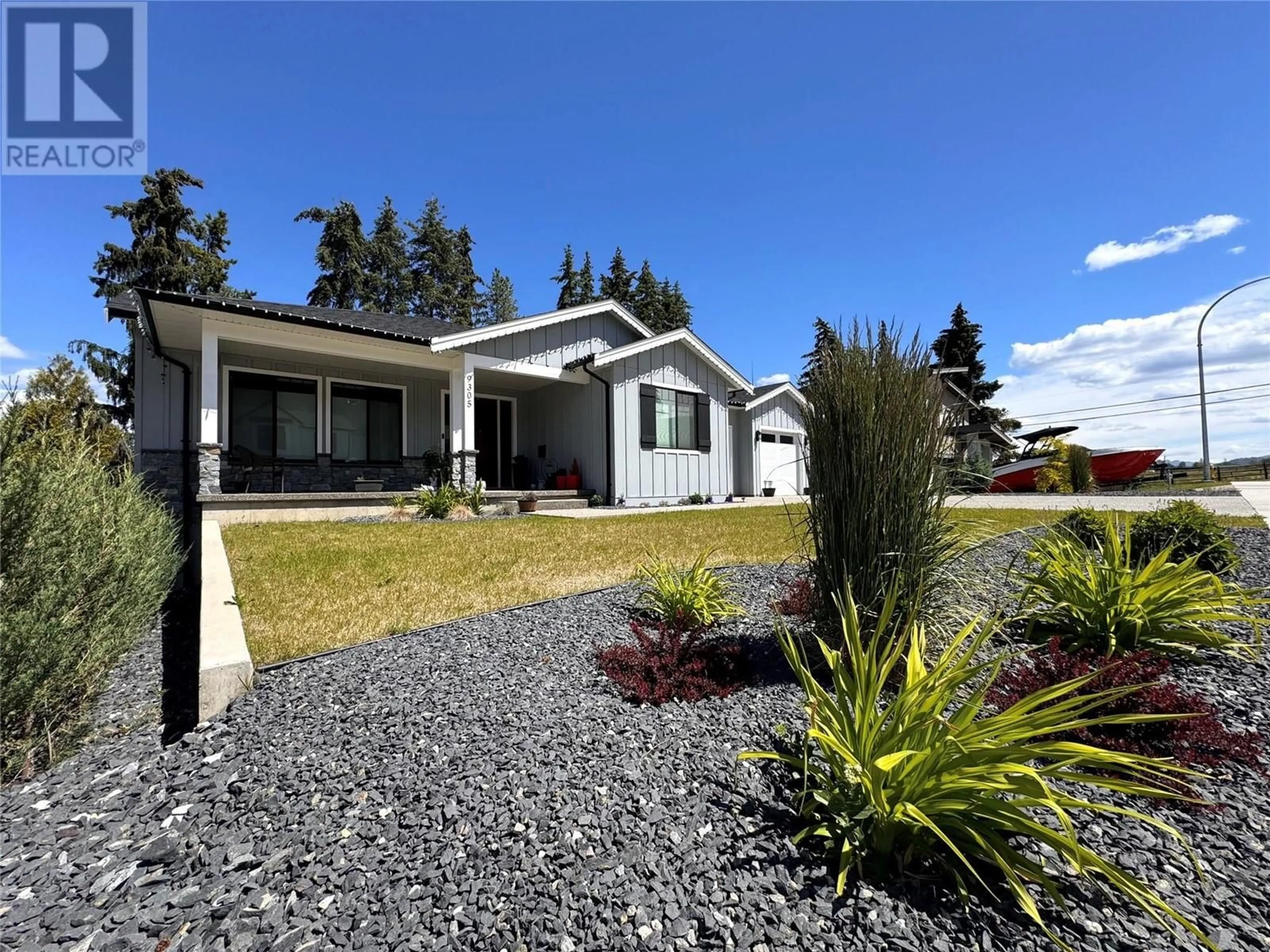 Home with vinyl exterior material for 9305 Elm Drive, Coldstream British Columbia V1B0A7