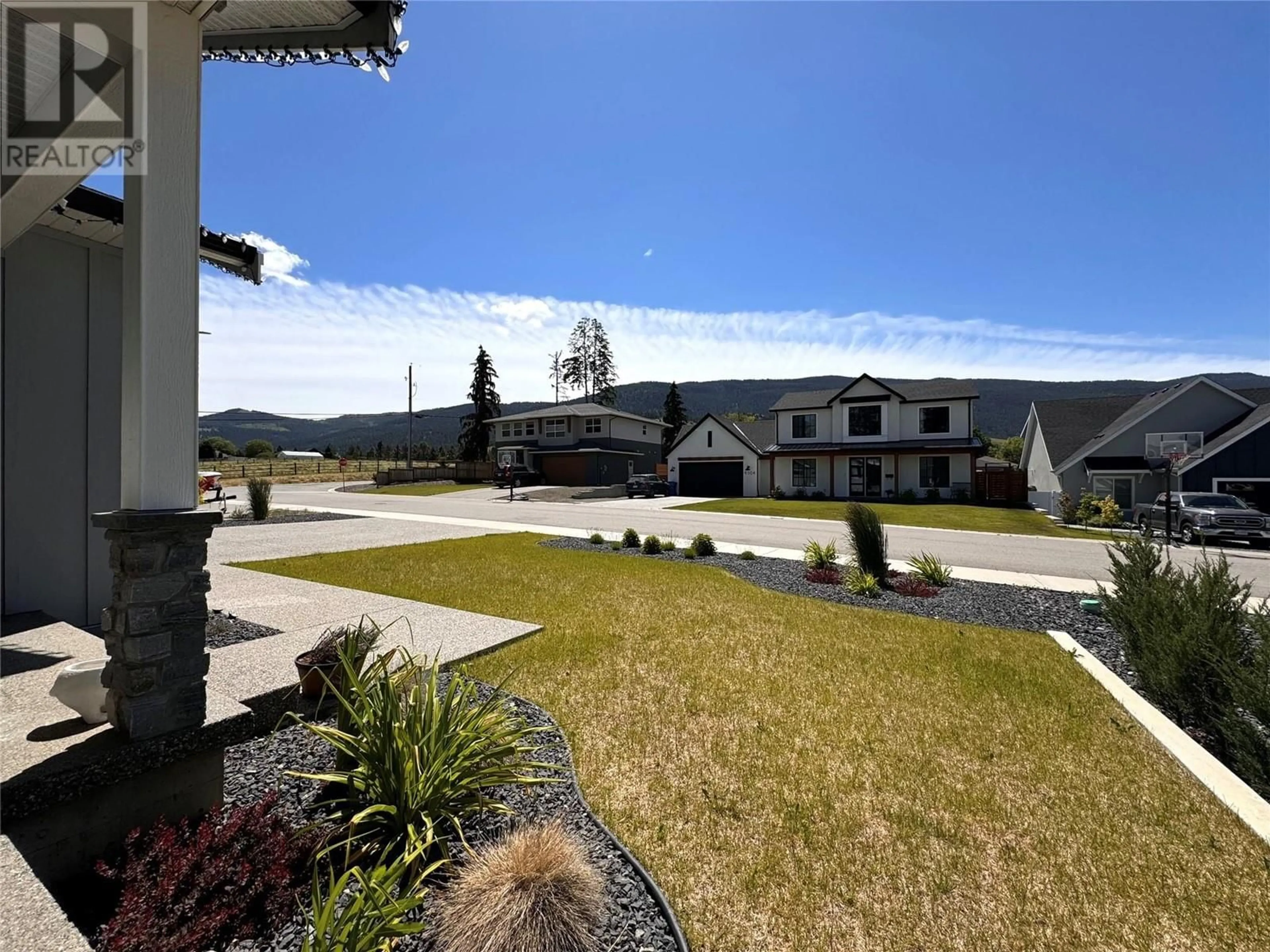 Frontside or backside of a home, the street view for 9305 Elm Drive, Coldstream British Columbia V1B0A7